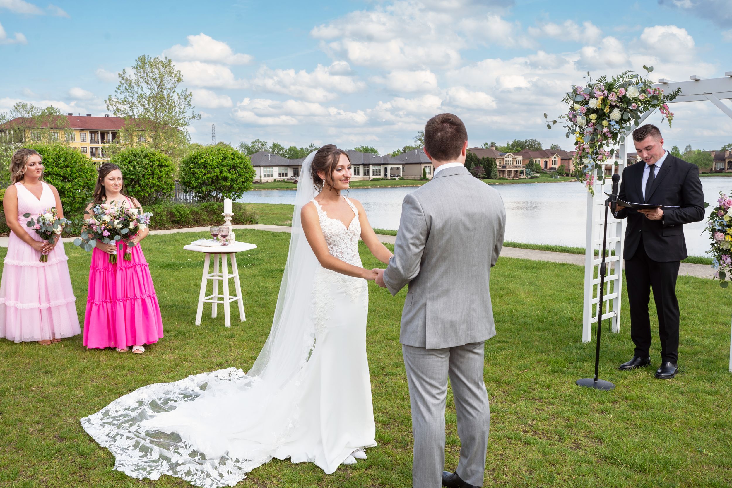 A collage of outdoor wedding ceremony photos showing floral arrangements and guests gathered on a grassy lawn.