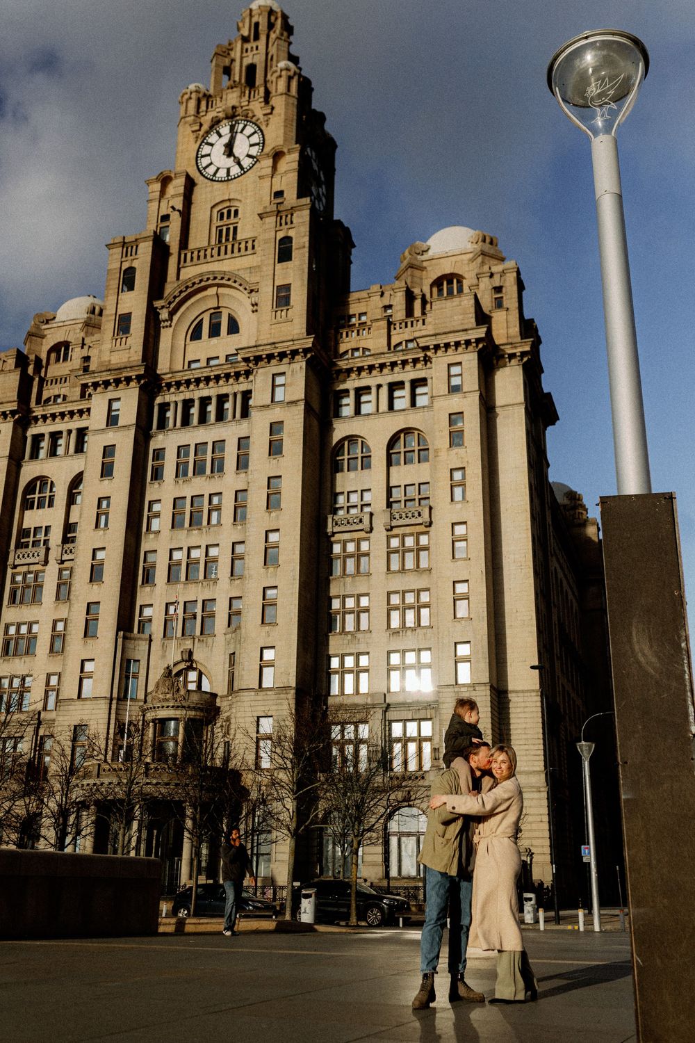 Historic Royal Liver Building in Liverpool stands tall against cloudy sky with its iconic clock tower and architecture.
