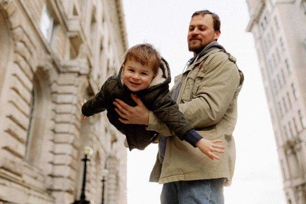 A series of four candid moments showing joyful interactions between two people in an urban setting.
