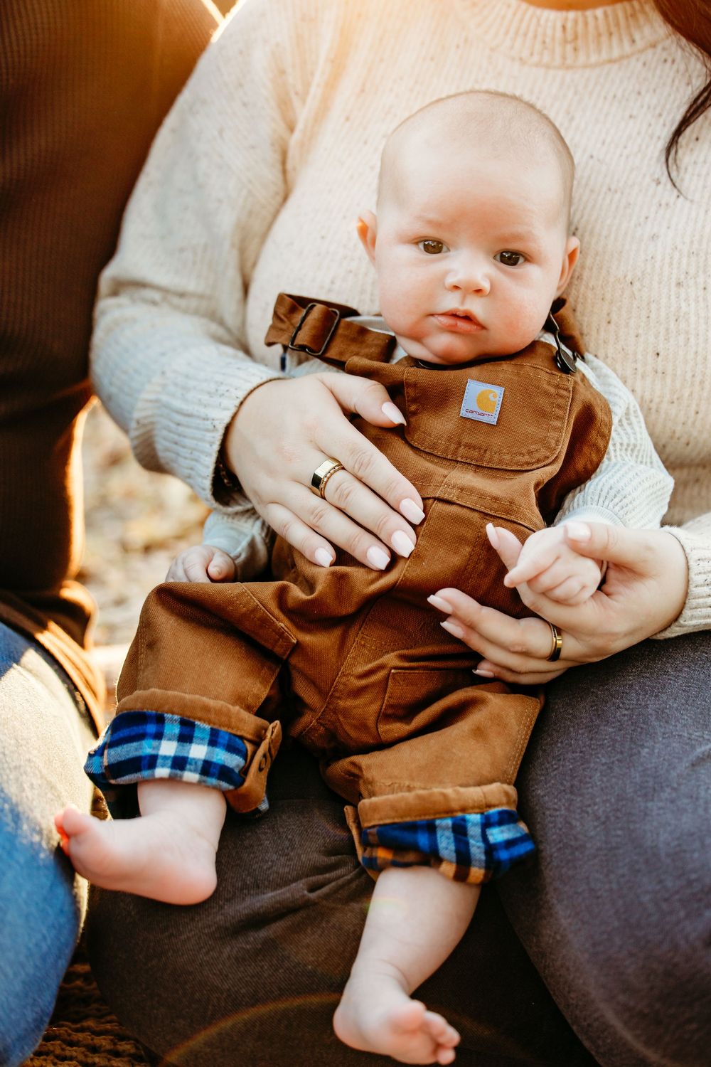 A series of photos showing small feet in brown leather boots with plaid fabric details against a light knit background.