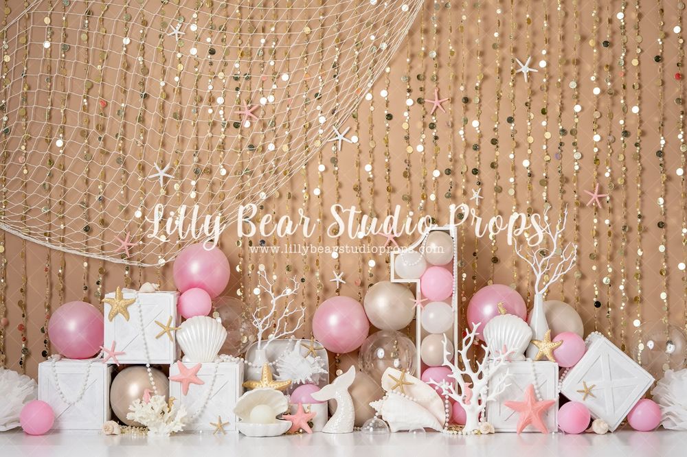Pink and white party setup with sequin backdrop, balloons, and decorative presents.