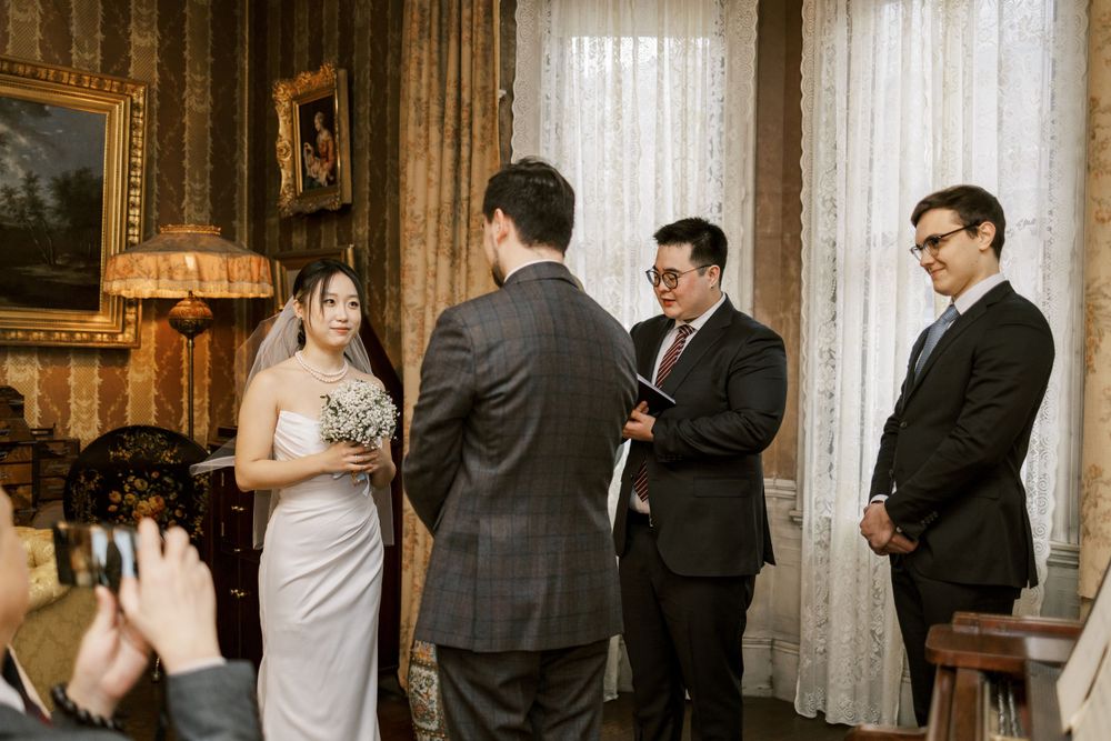 Wedding ceremony candid shots in an elegant room with couples and guests in formal attire.