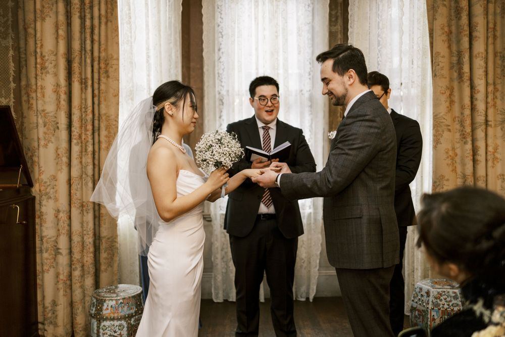 Indoor wedding ceremony captured in sequence with warm lighting and elegant drapes.