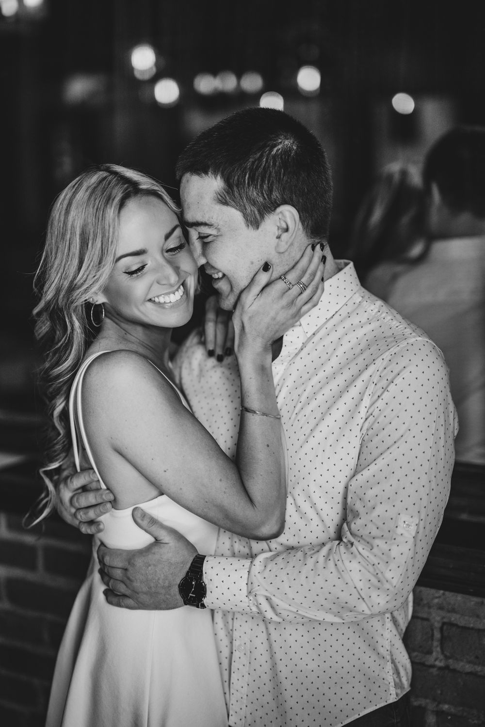 Romantic couple sharing intimate moments in black and white photography series.