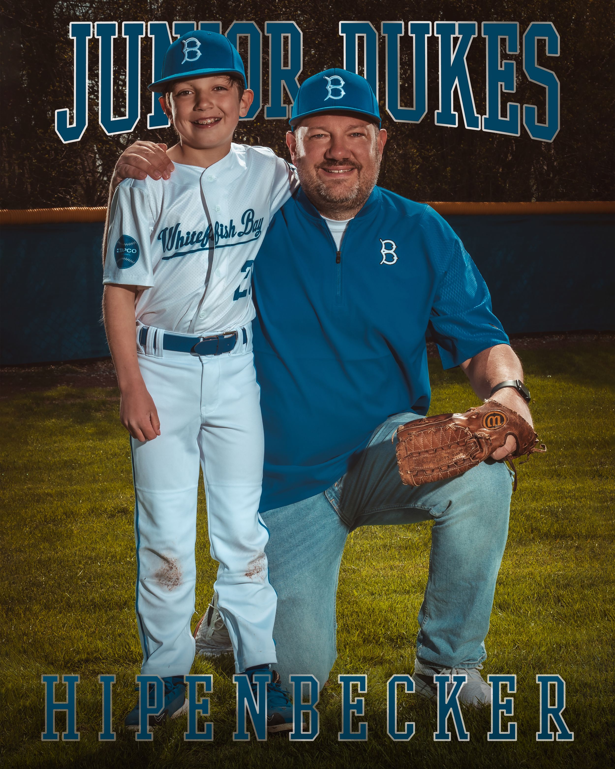 A youth baseball player and coach pose together in uniform against a blue background with team branding.