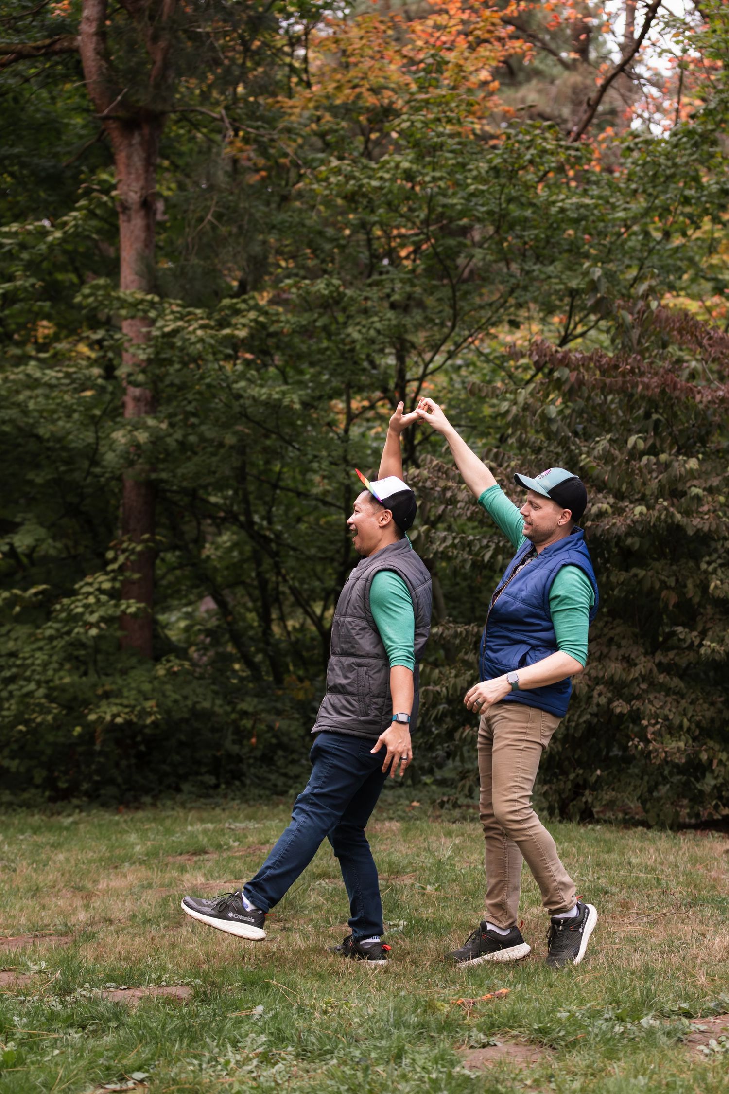 Two children play together in a park during autumn, demonstrating a falling down sequence in four connected photos.
