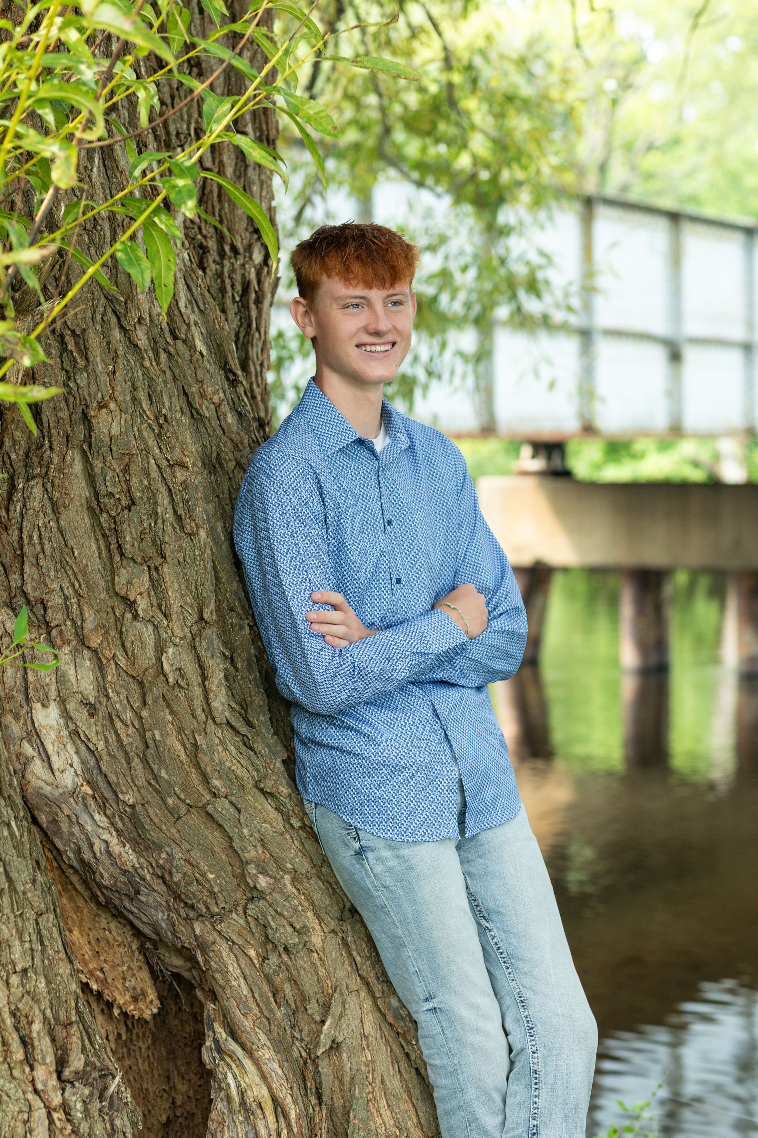 A series of casual outdoor portrait shots taken by a tree near water on a bright sunny day.