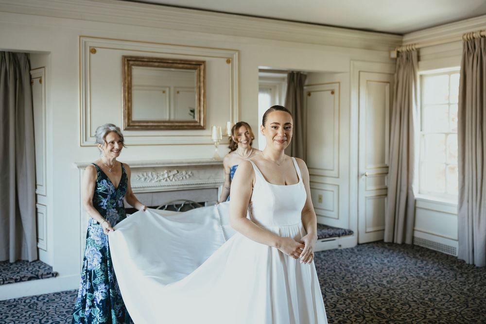 A series of wedding preparation moments captured in a bridal suite with elegant white decor and natural lighting.