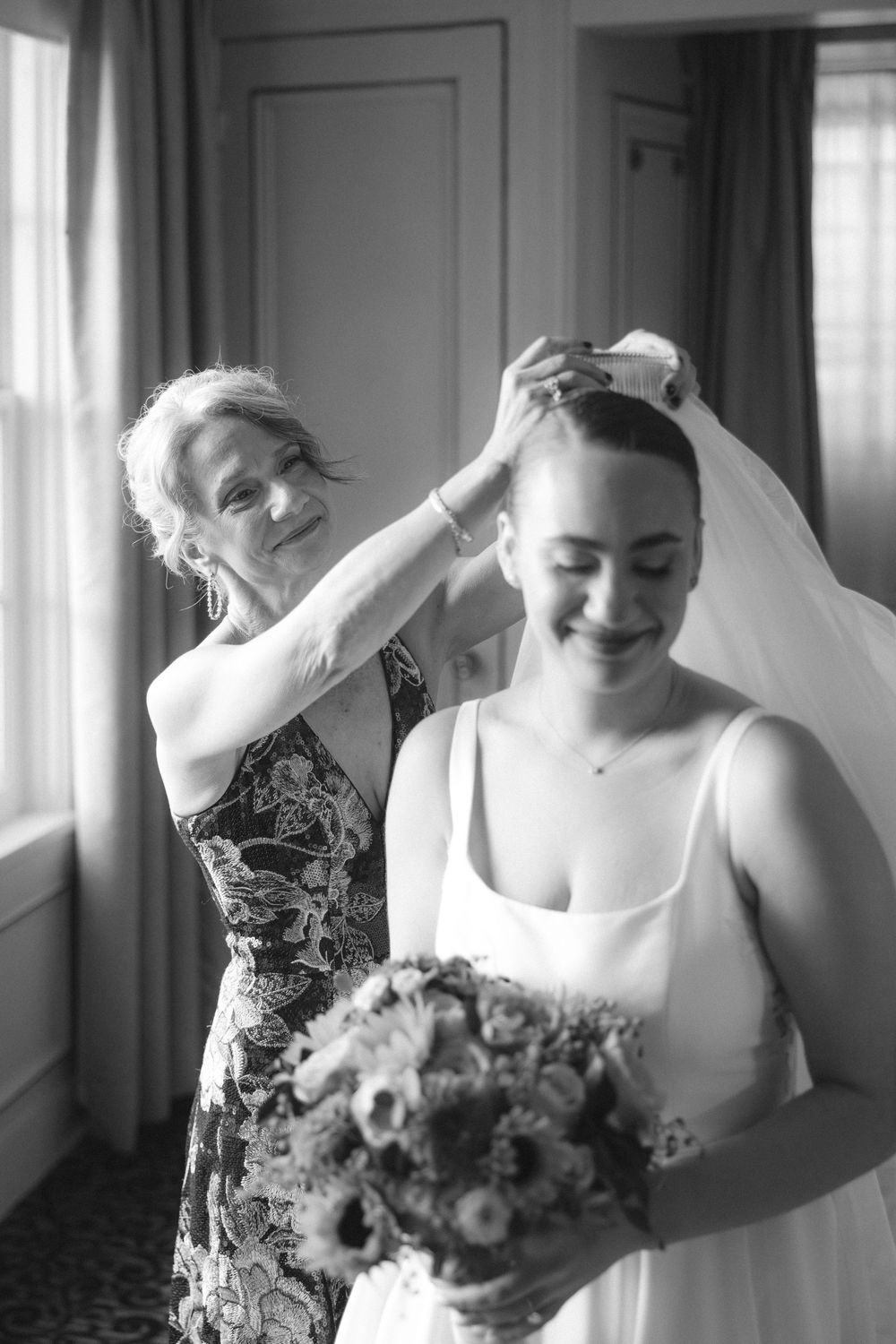 A series of candid black and white photographs capturing intimate moments during wedding day preparations.