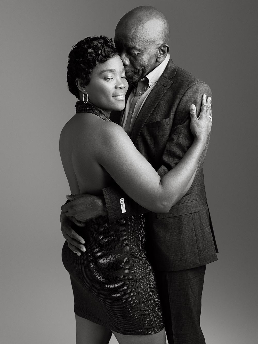 Elegant black and white portraits capture tender moments between a couple in intimate dance poses.