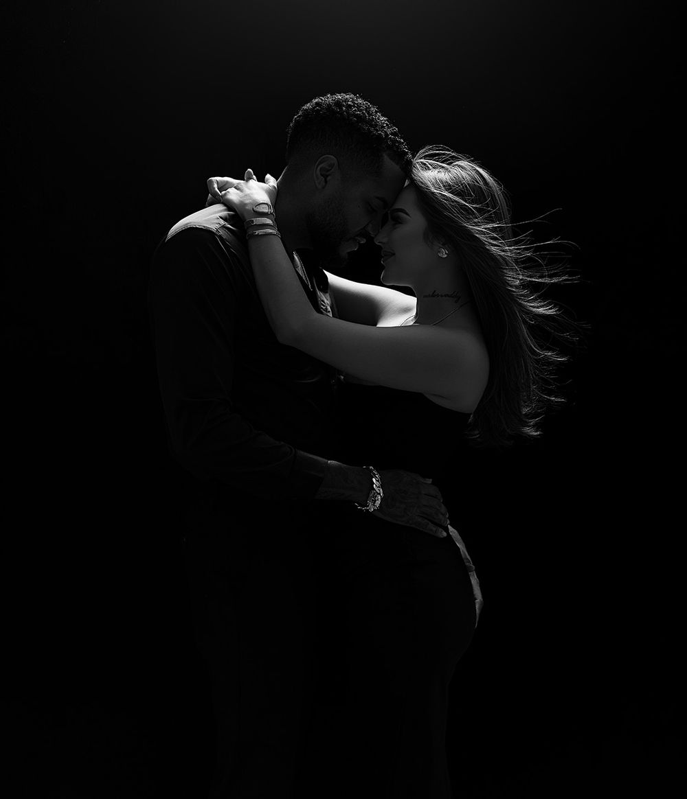 A dramatic black and white portrait series showing a figure in silhouette with flowing hair against dark backgrounds.