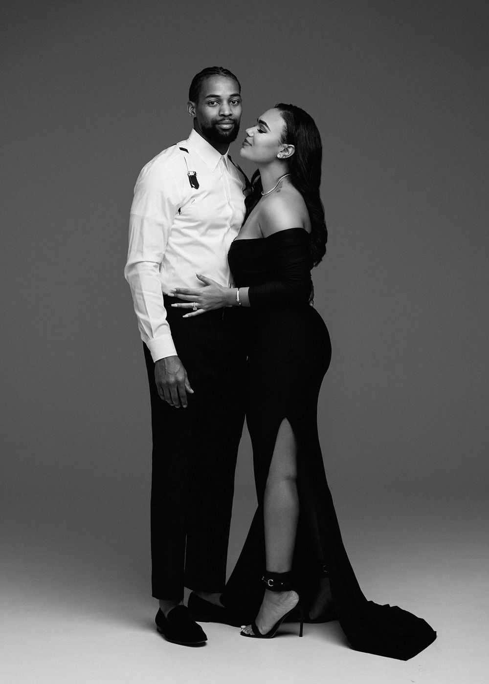 A romantic black and white photo series showing a couple in formal attire embracing in various intimate poses.