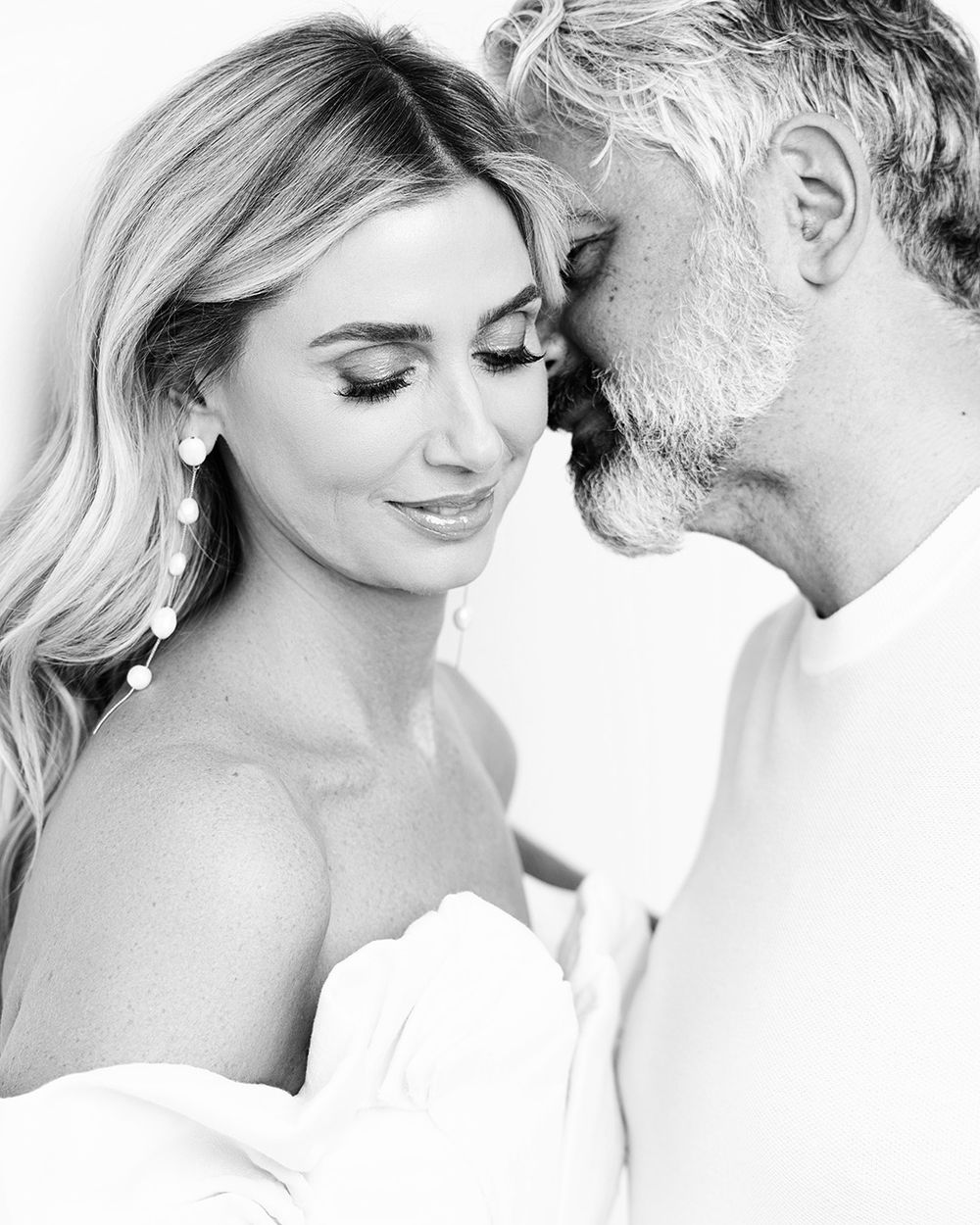 A series of romantic black and white portraits showing intimate moments between a couple on their wedding day.