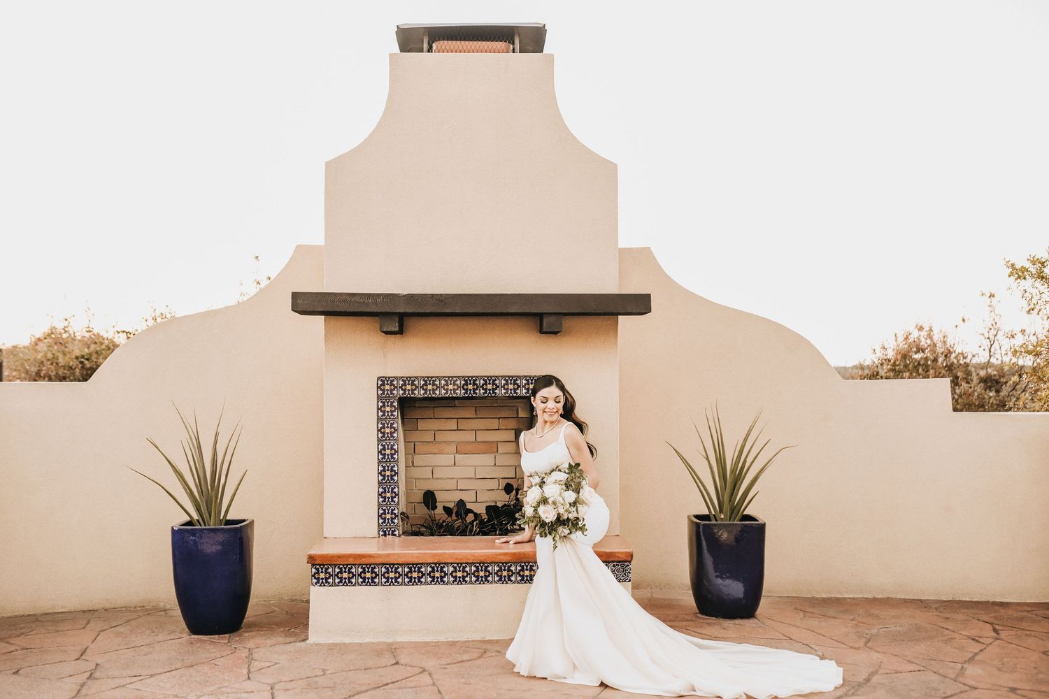 Bride framed by Spanish arches at Stoney Ridge Villa wedding venue in Azle Texas