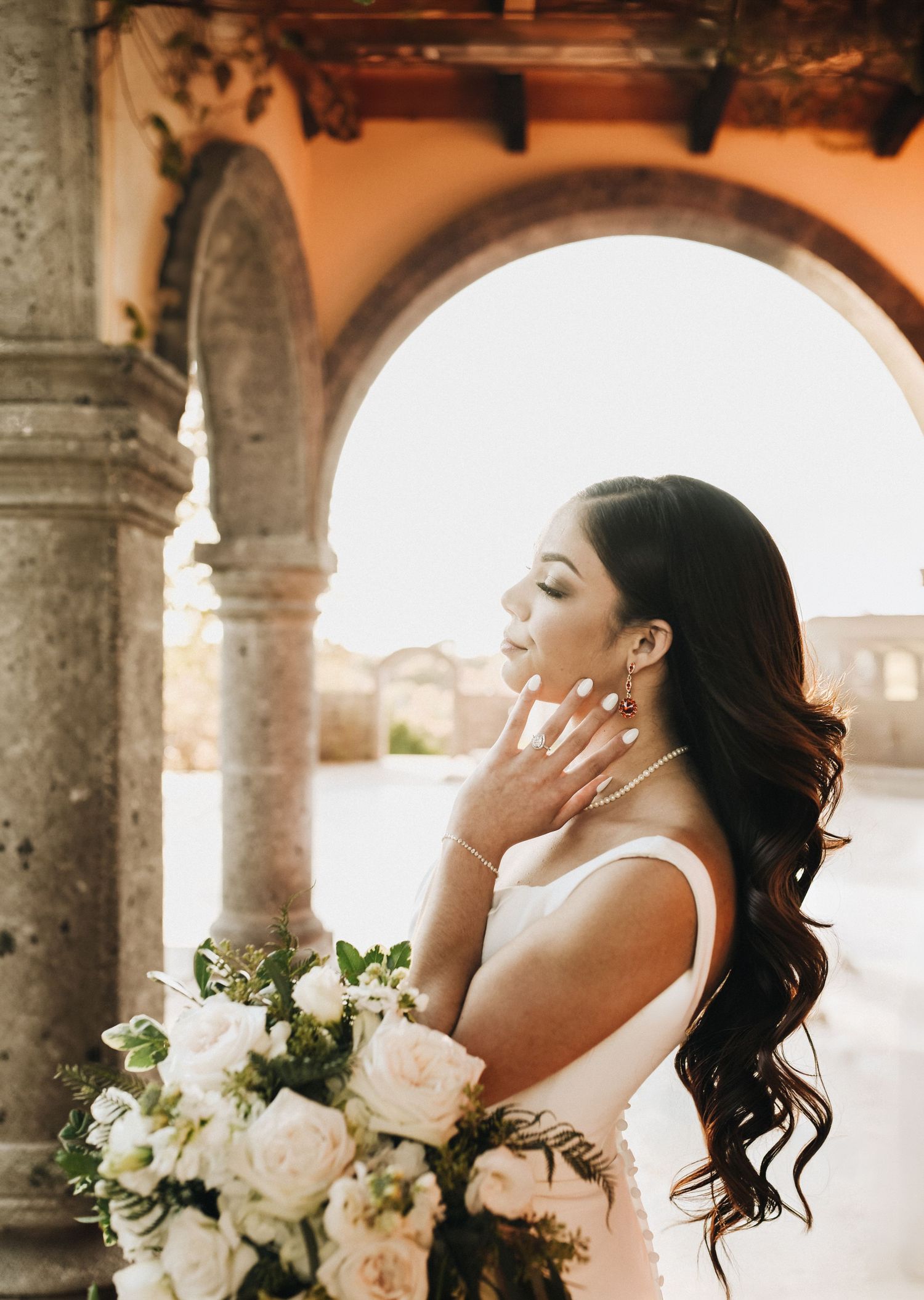 Fine art bridal session with European inspired arches and warm stone textures