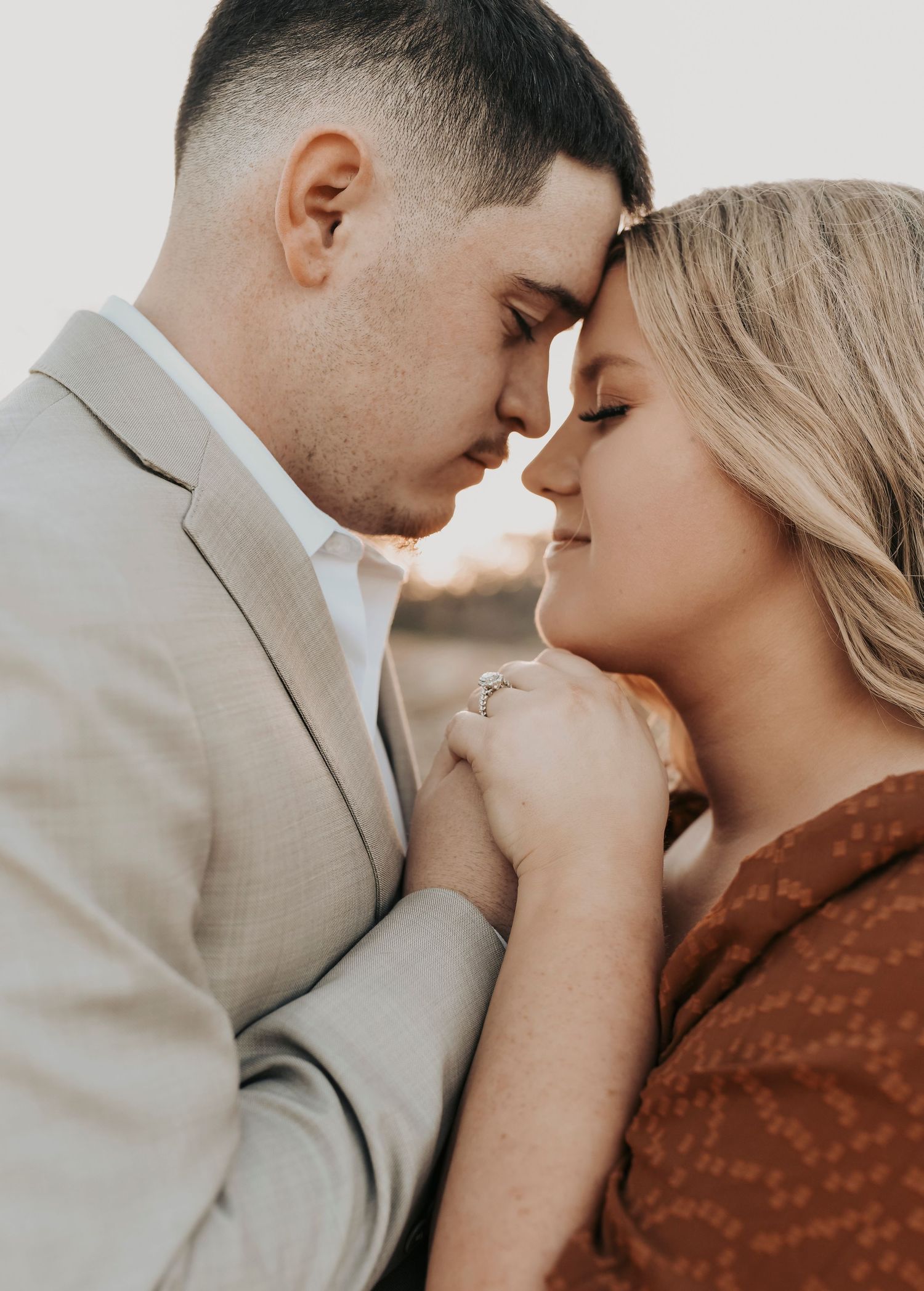 Hunter wearing a rust dress during Murrell Park engagement session in Flower Mound.