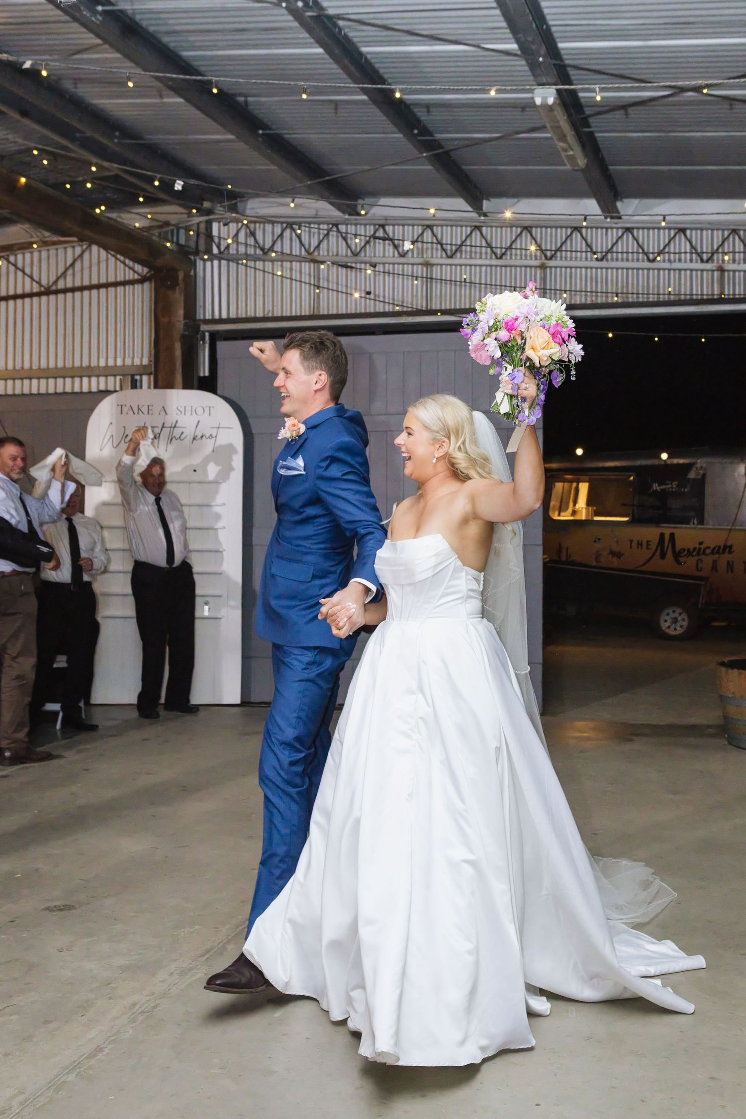 Bride and groom grand entrance into rustic reception area at Dungog Weddings in Hunter Valley NSW