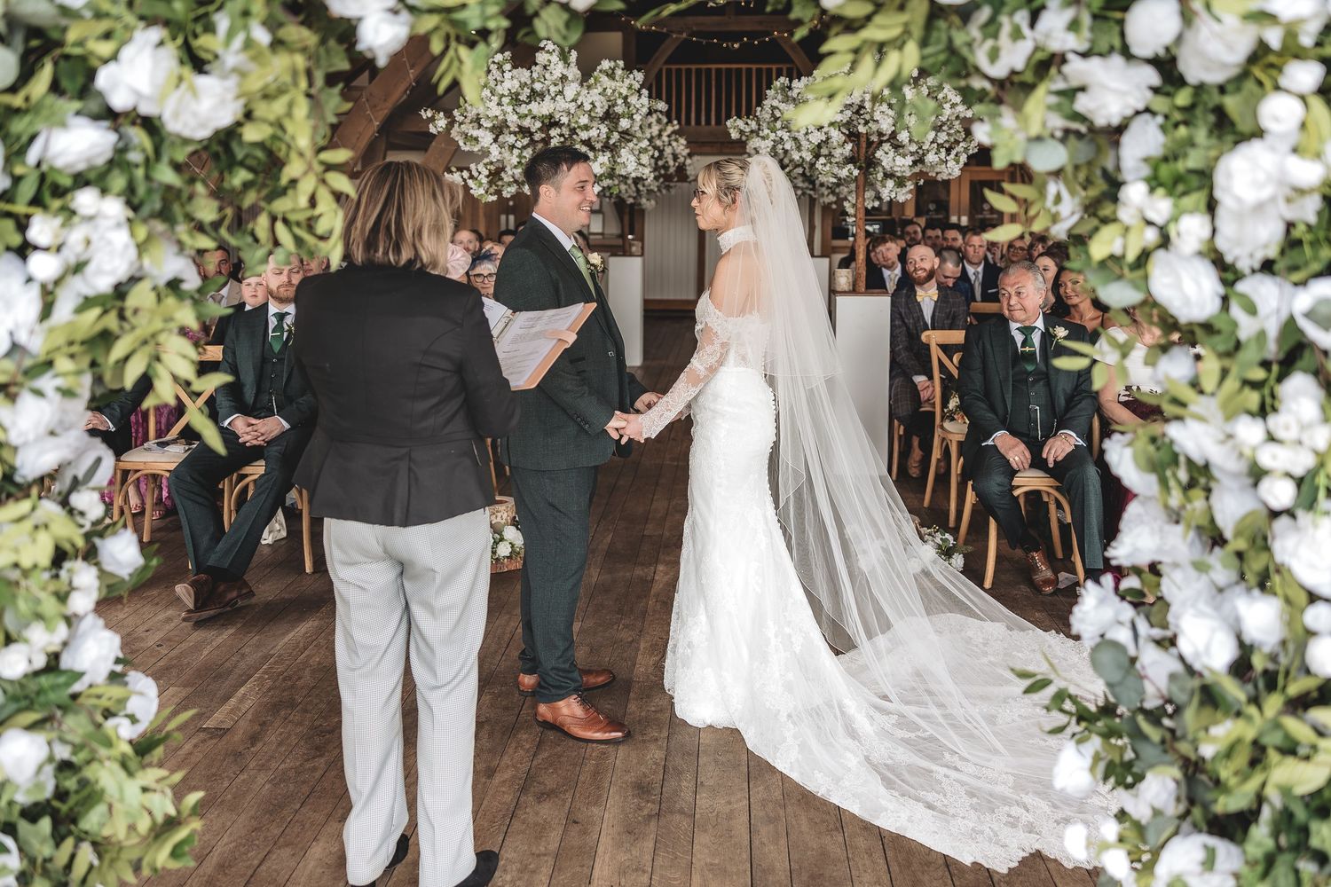 Couple exchanging vows during a registrar led wedding