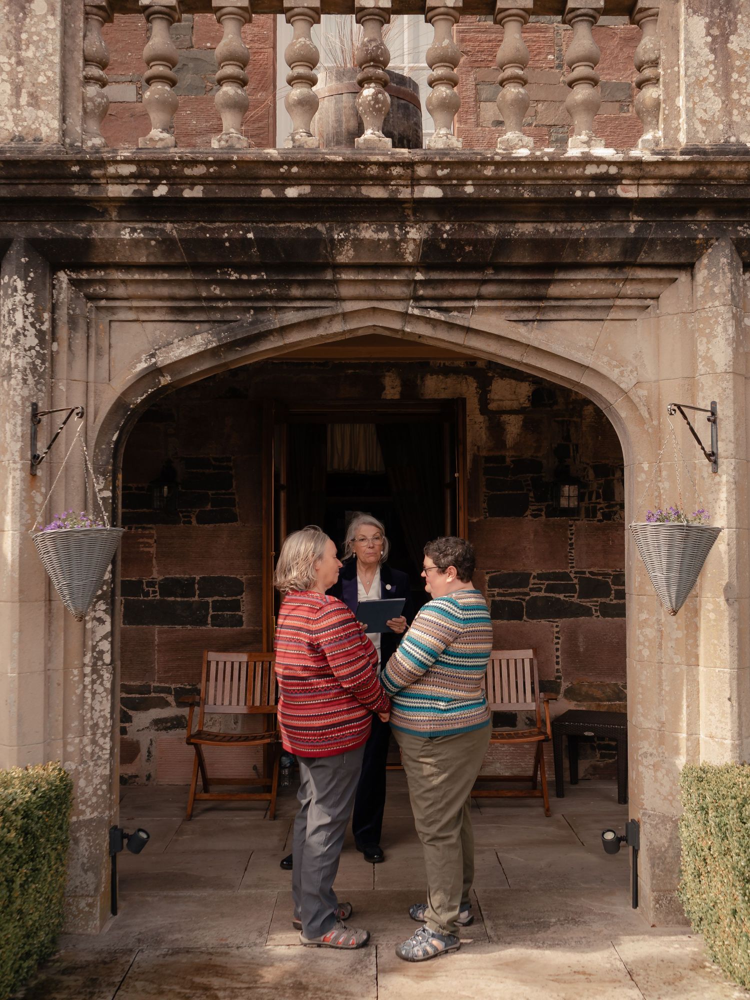 Romantic portrait of a newly married couple on the terrace at Stobo Castle, Scotland, during their intimate elopement.