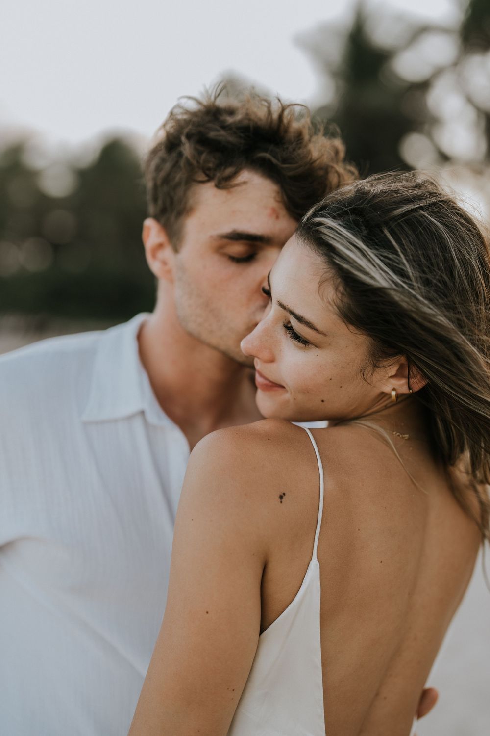 Professional proposal photographer capturing engagement moment in Nusa Dua
