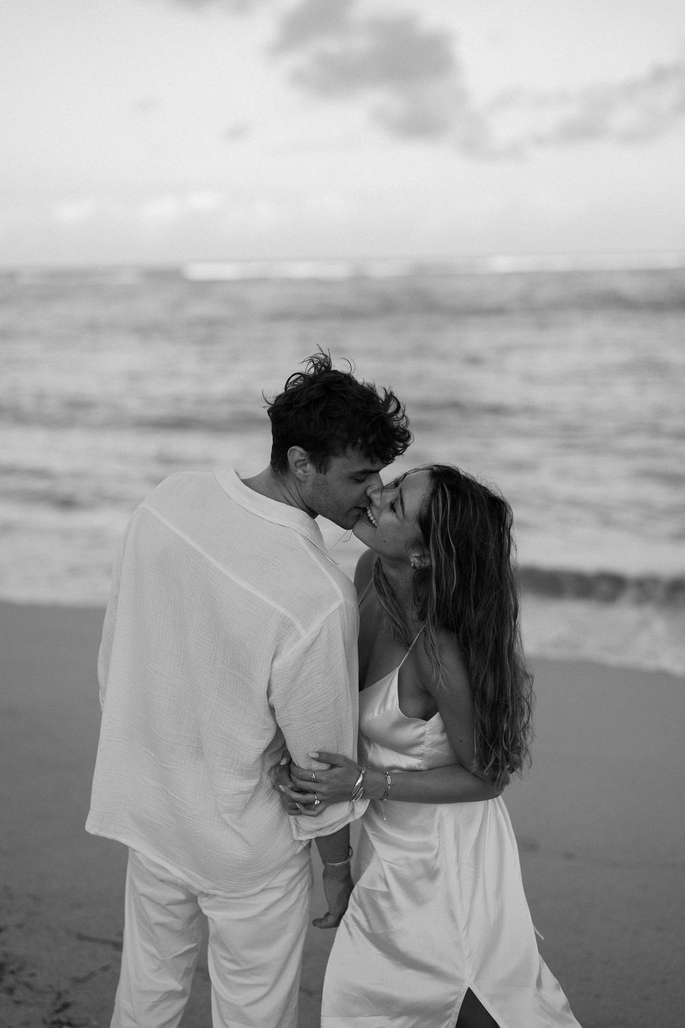Secret proposal at Nusa Dua Beach Bali during golden sunset with ocean backdrop