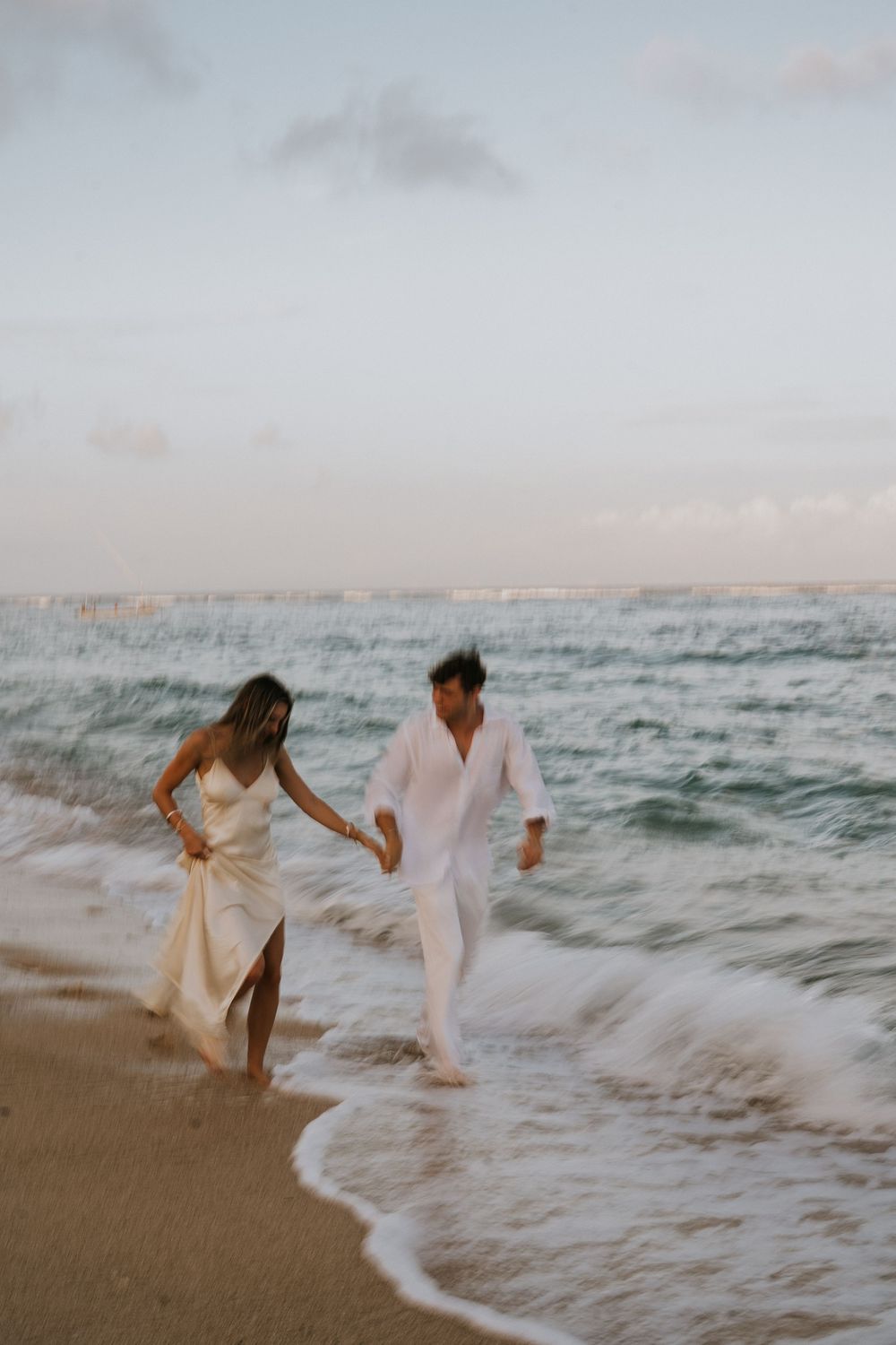 Secret proposal at Nusa Dua Beach Bali during golden sunset with ocean backdrop