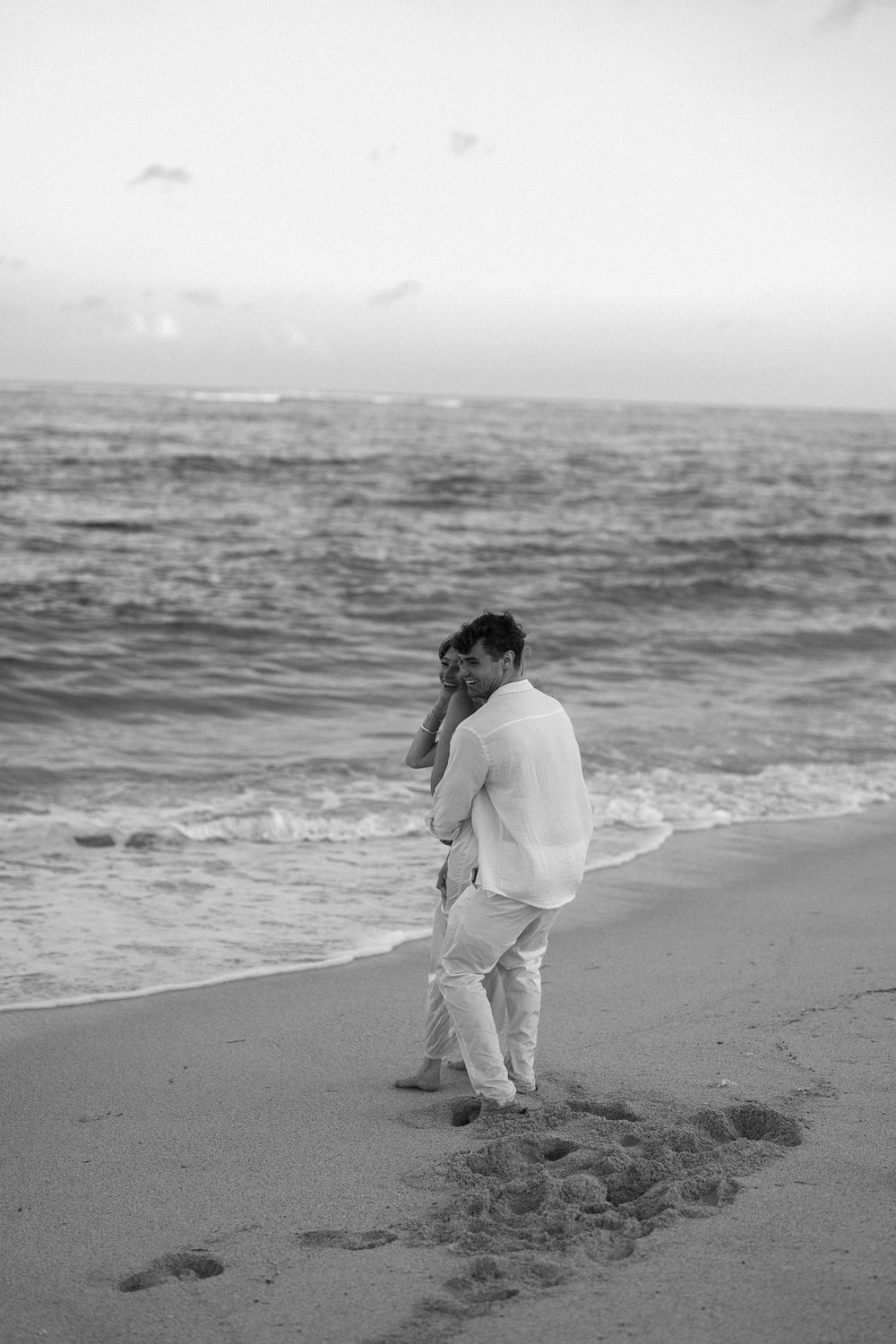 Secret proposal at Nusa Dua Beach Bali during golden sunset with ocean backdrop