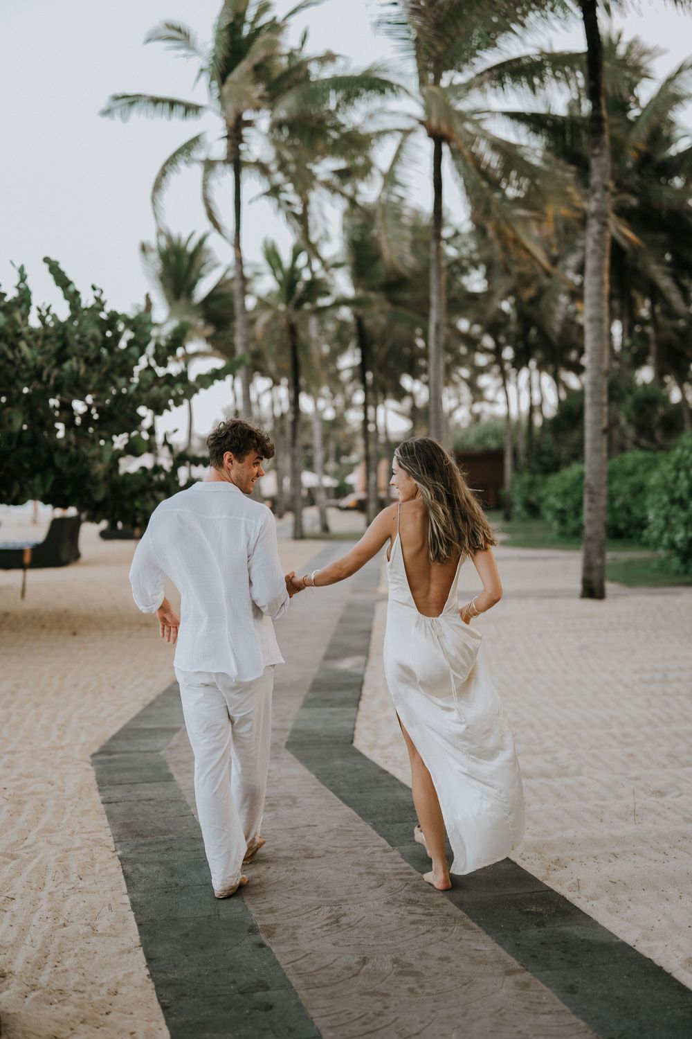 Secret proposal at Nusa Dua Beach Bali during golden sunset with ocean backdrop