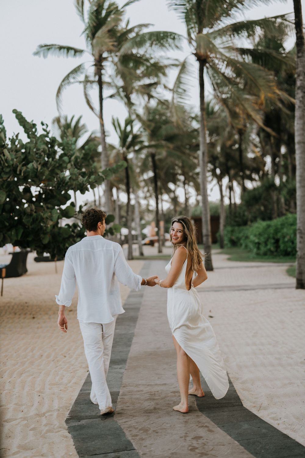 Professional proposal photographer capturing engagement moment in Nusa Dua