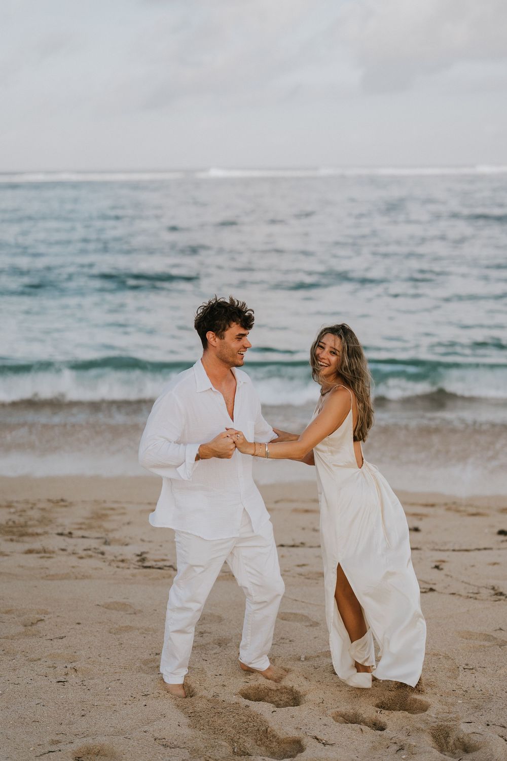 Secret proposal at Nusa Dua Beach Bali during golden sunset with ocean backdrop