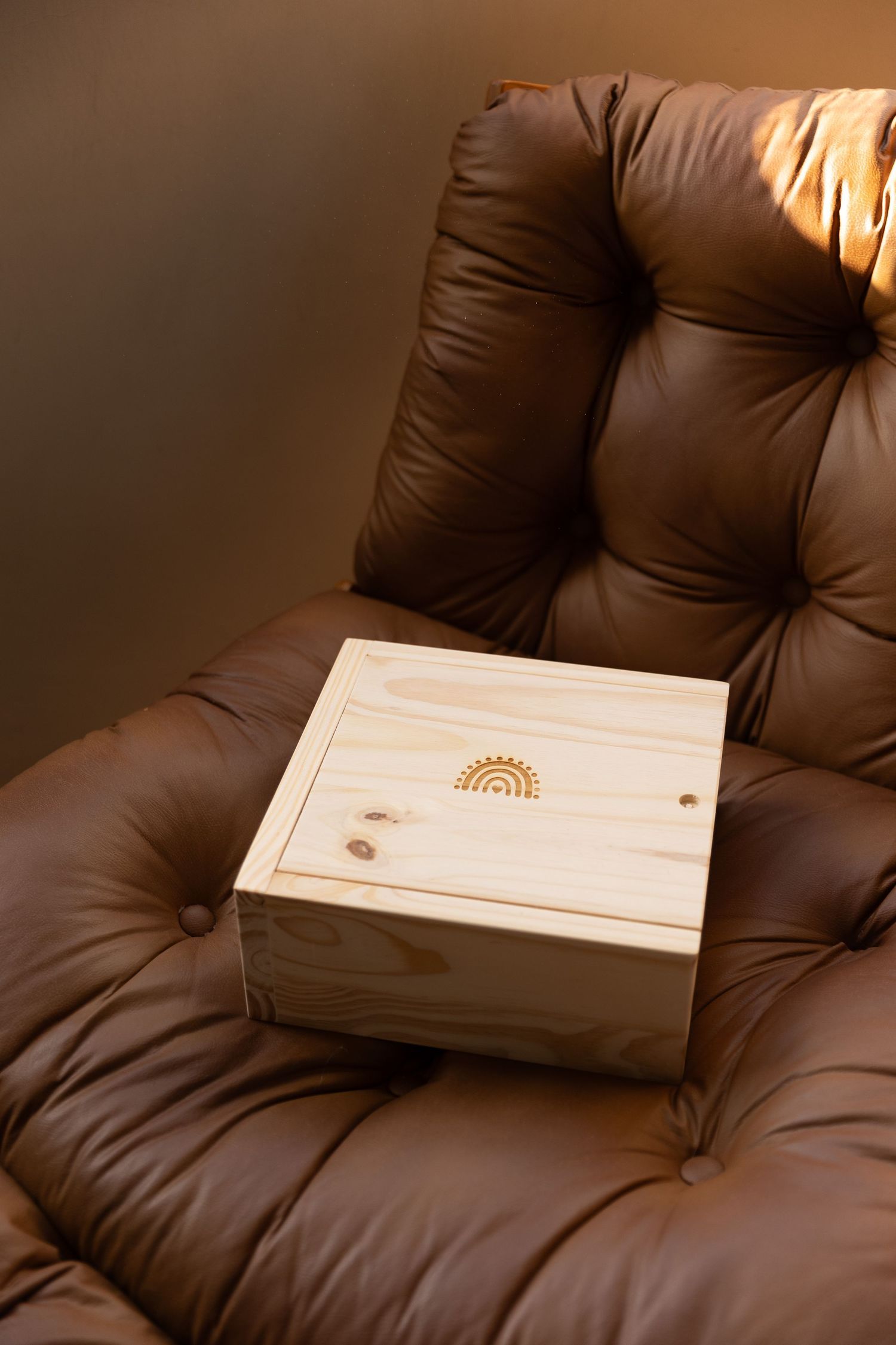 Elegant linen wedding album with embossed names Isabella and Anthony in a wooden keepsake box.