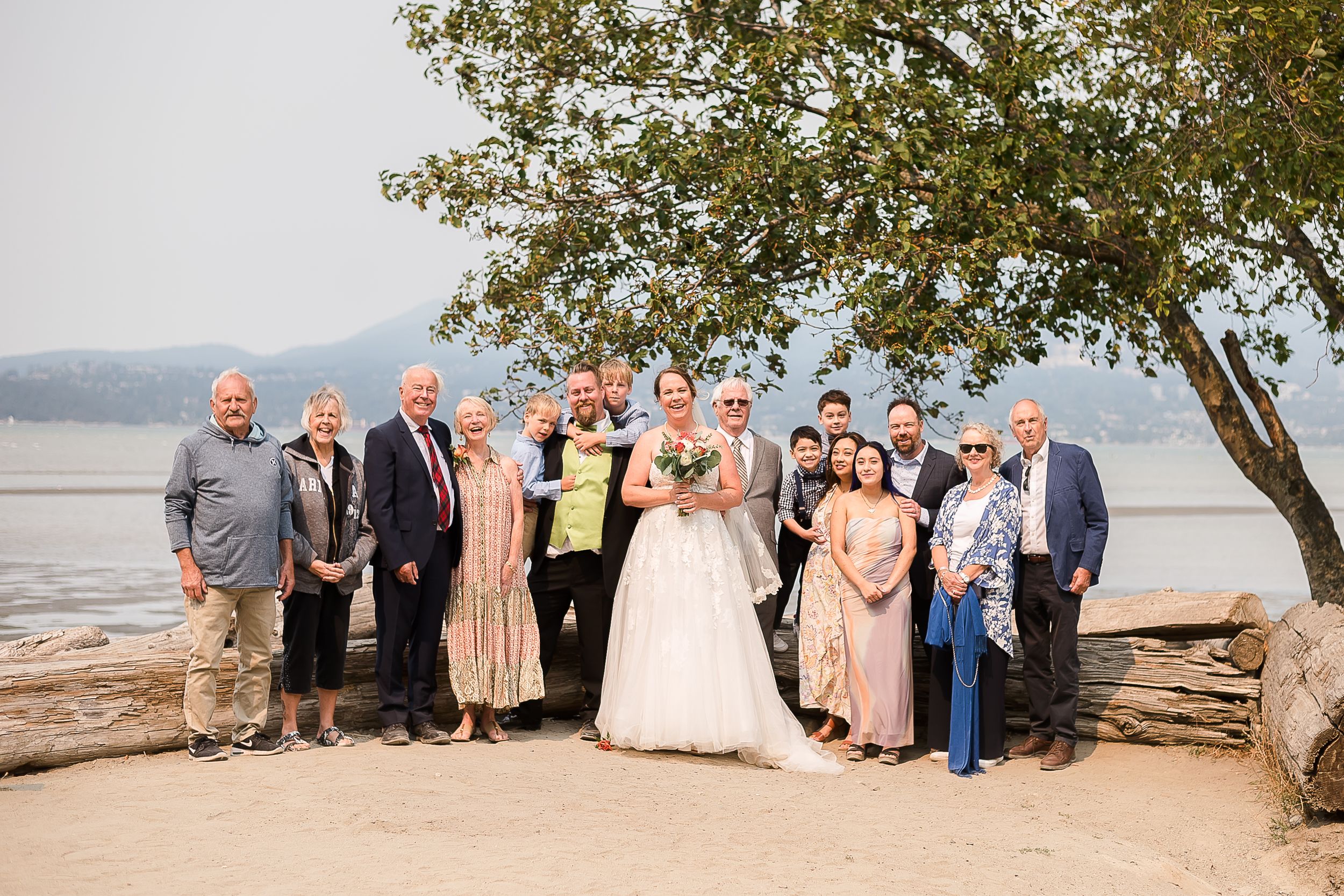 Wedding couple celebrating with their family after the ceremony.