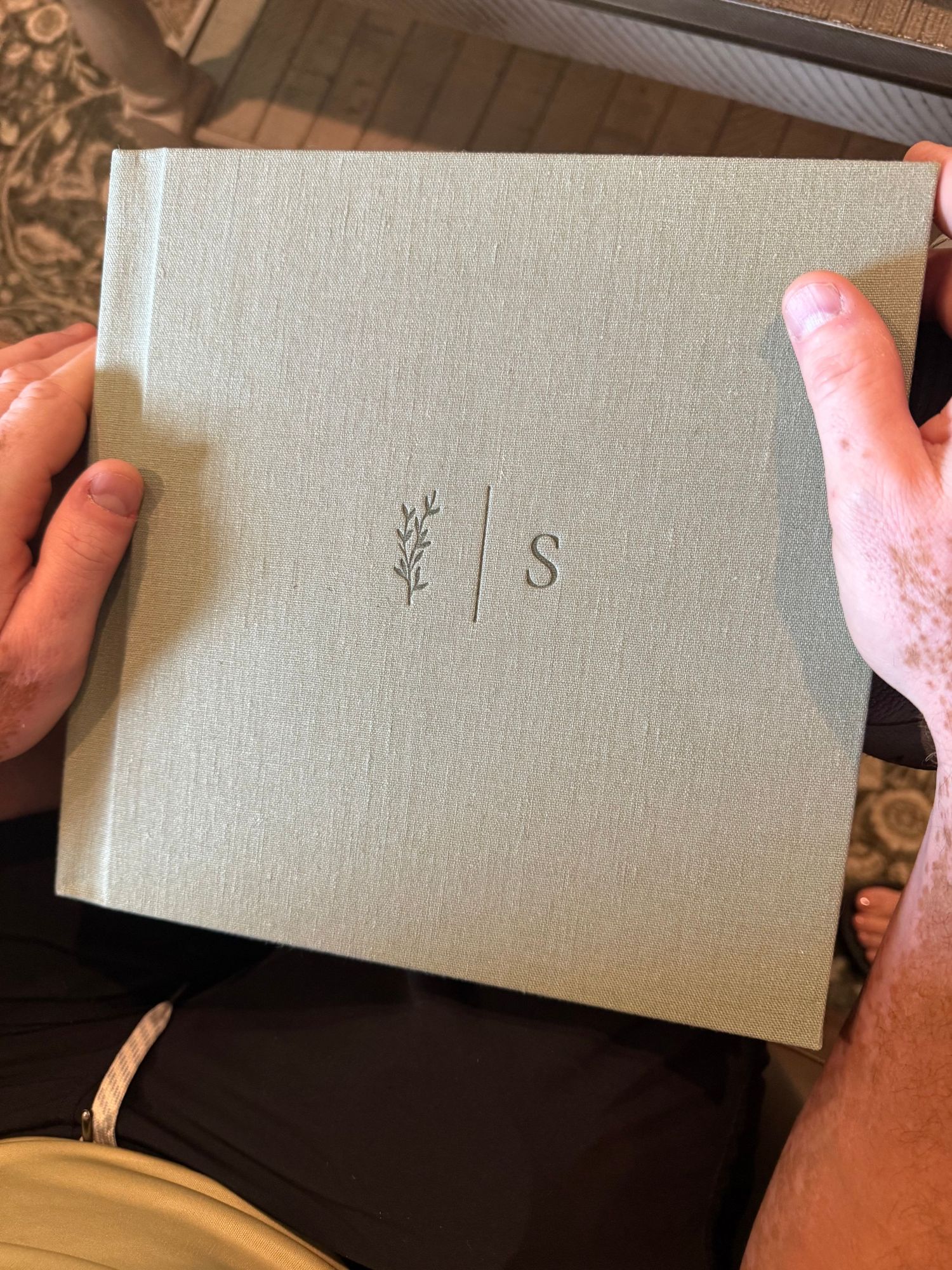 Custom linen photo album preserving a family’s beach photography session with Lindy Rebro who serves Amelia Island, Fernandina Beach, FL