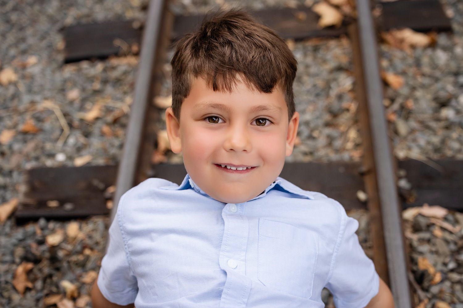 A portrait of a smiling boy during his family photo session in Los Gatos
