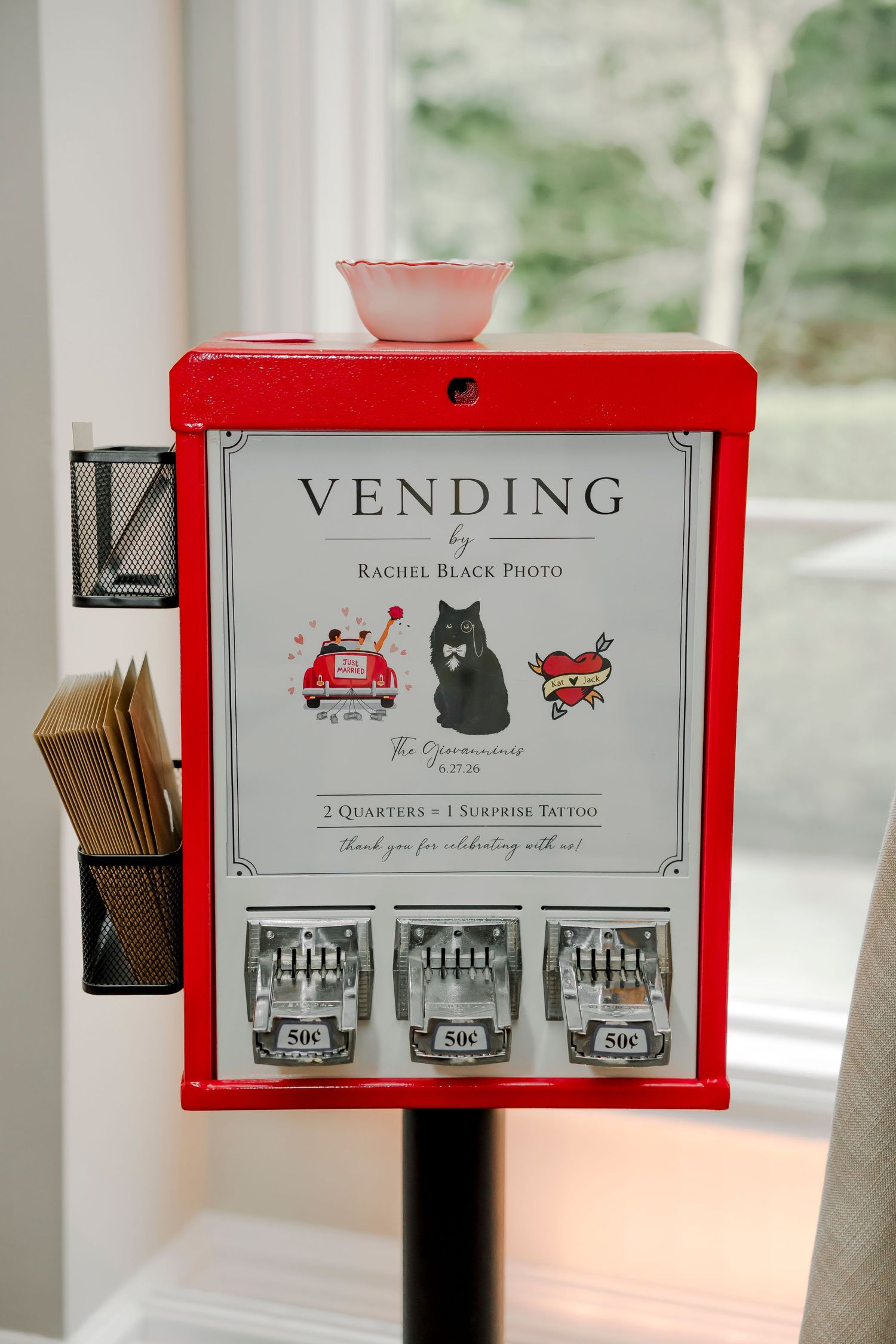 Red vending machine by Rachel Black Photo offering surprise tattoos for 50 cents at The Oppenheimer wedding event.