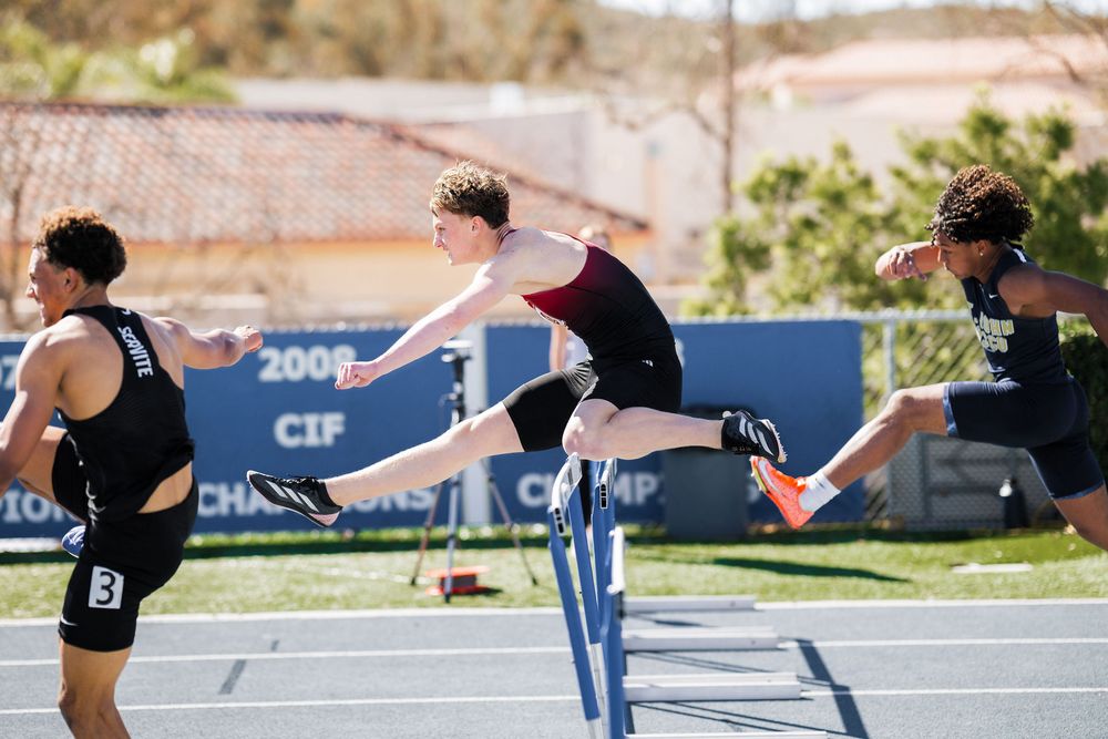 Orange Lutheran  High School Track and Field athlete hurdling
