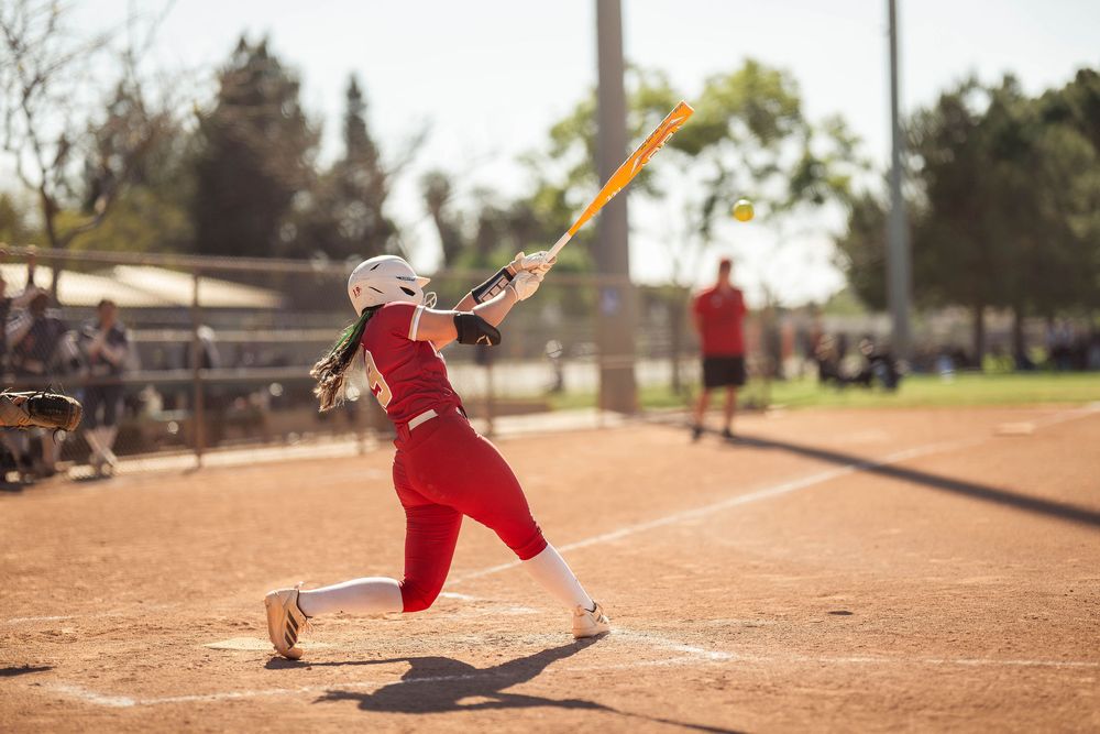 Orange Lutheran High School softball player swings bat