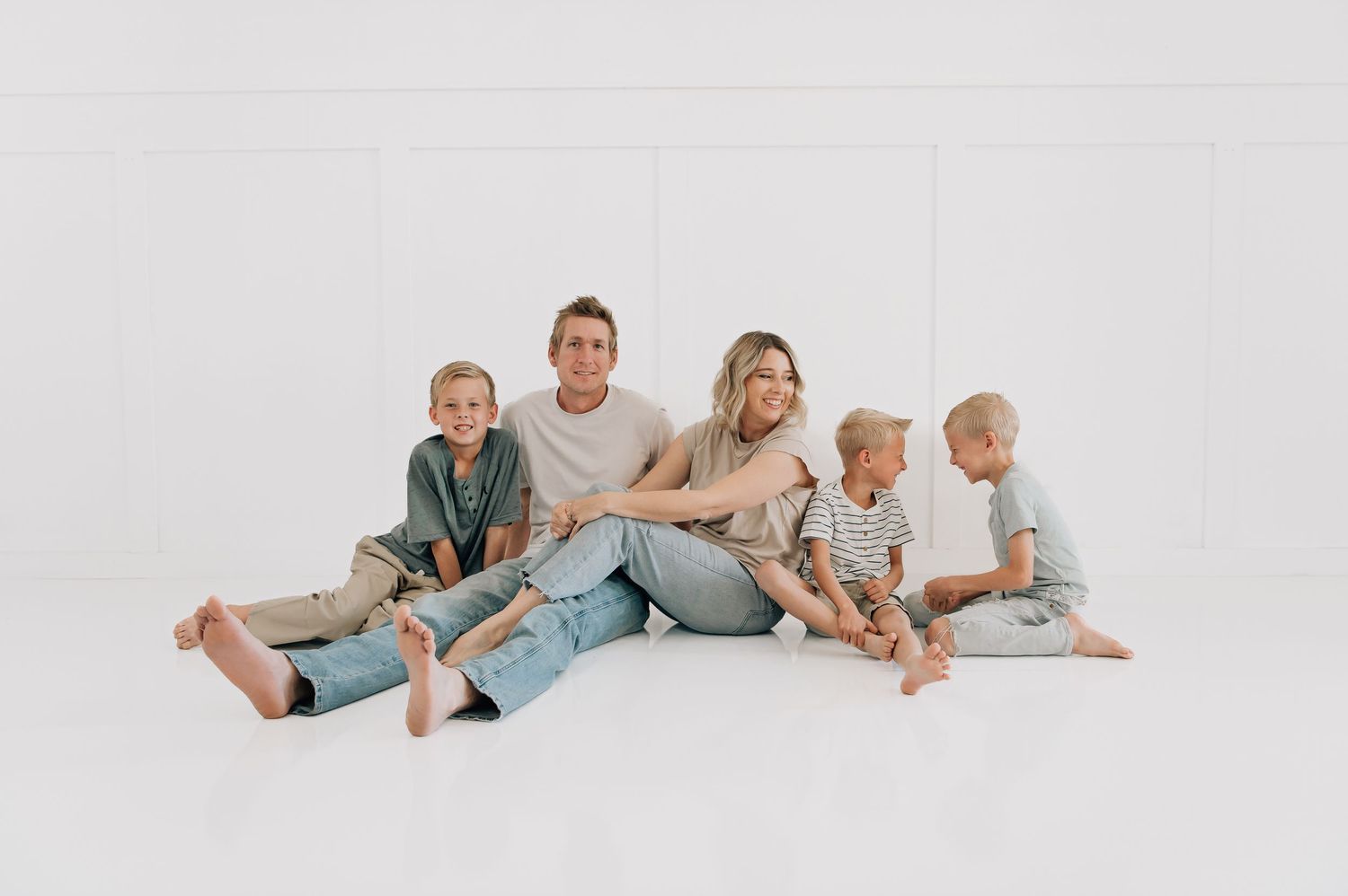 Peoria family photographer capturing a joyful studio session with parents and children