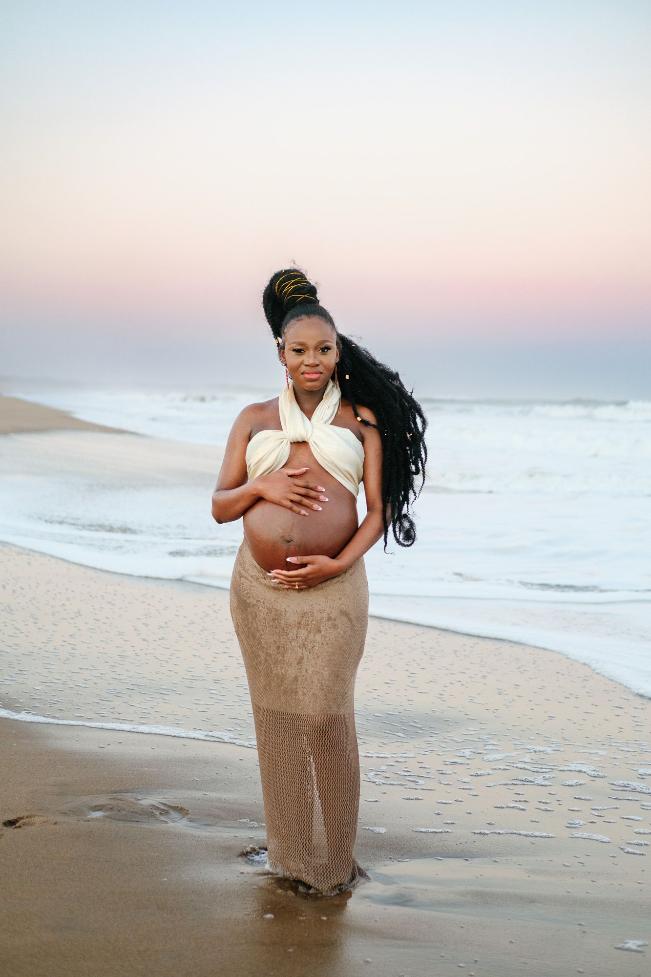Pregnant woman with ocean in the background