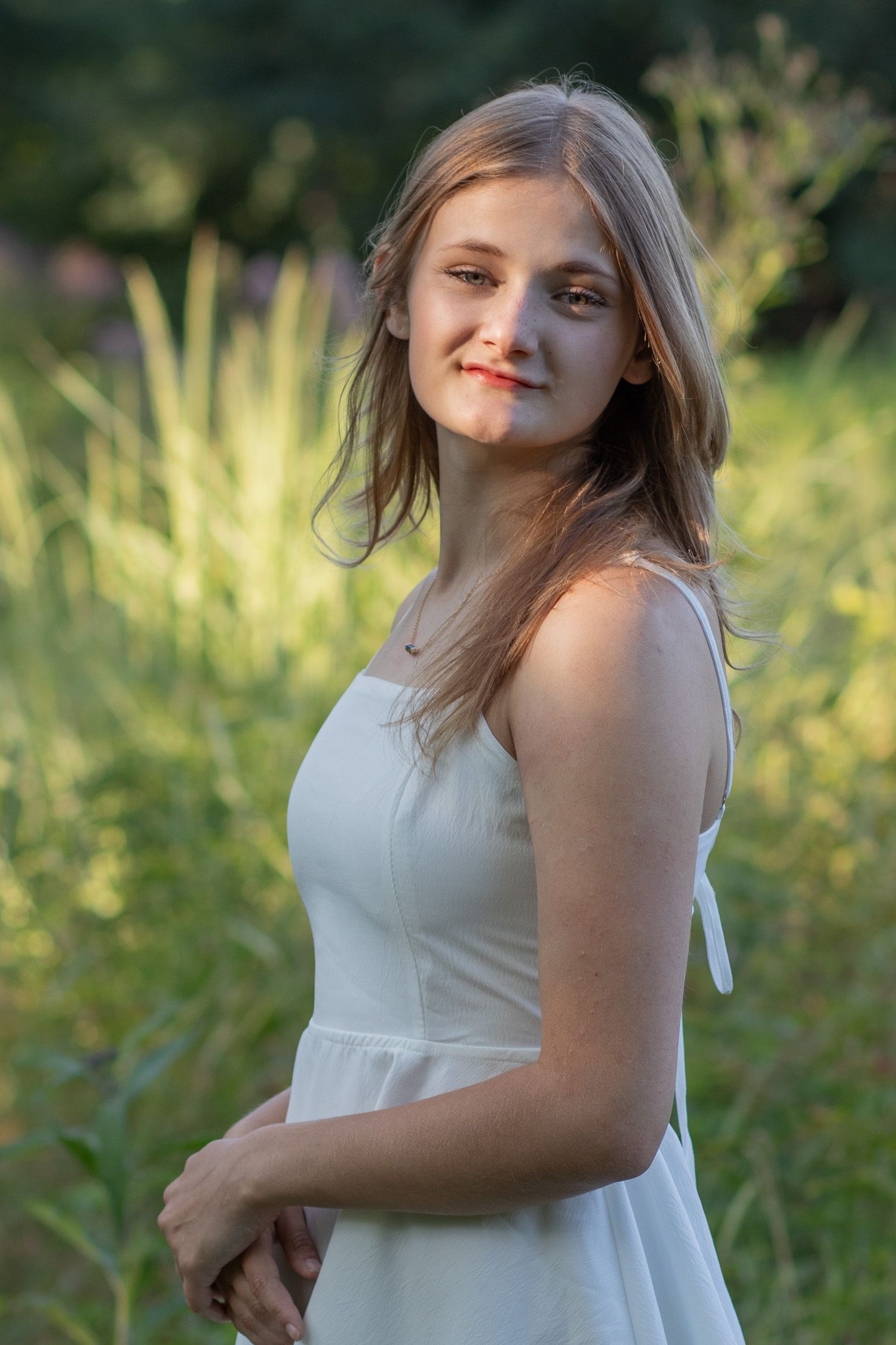 Senior girl taking photos in a meadow in Strongsville.