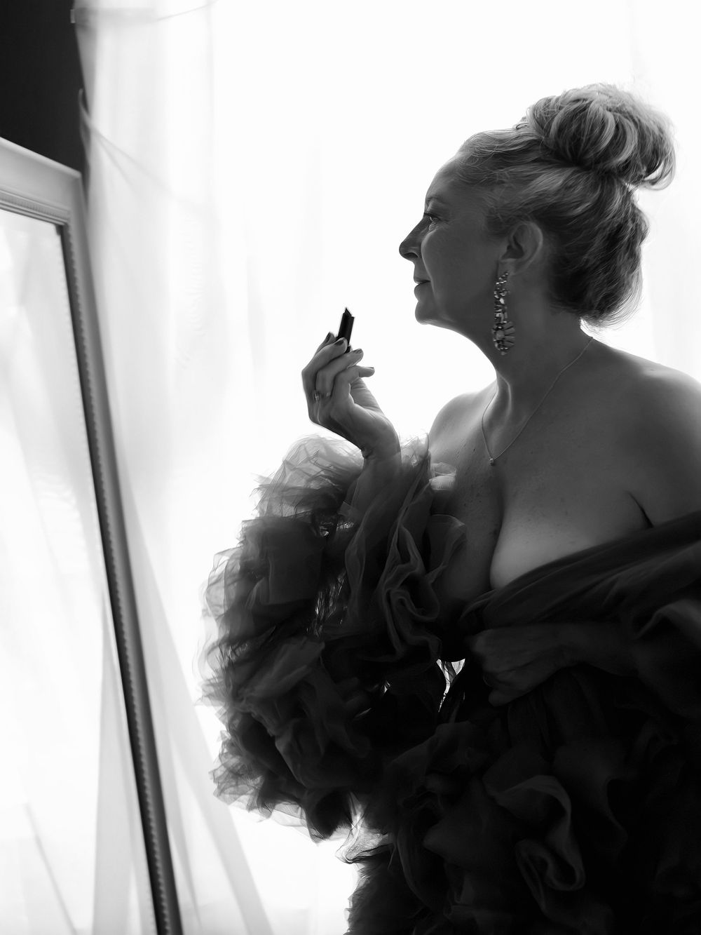 High-end fine art boudoir portrait of a woman celebrating her identity and confidence with Shira W Rose.