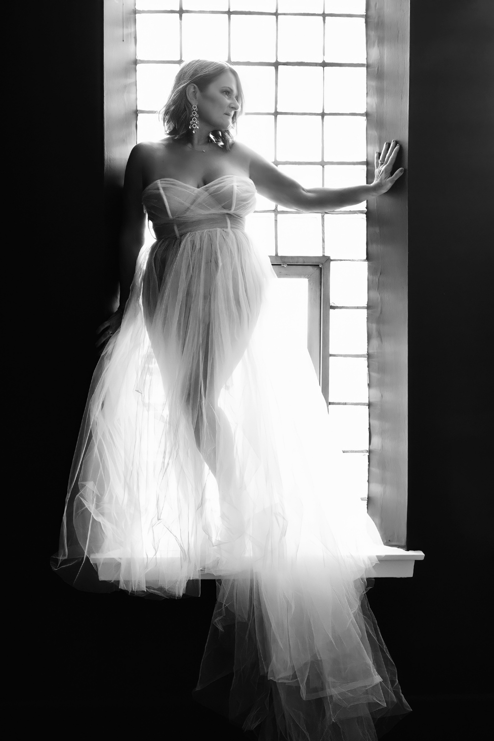 High-end fine art boudoir portrait of a woman celebrating her identity and confidence with Shira W Rose.