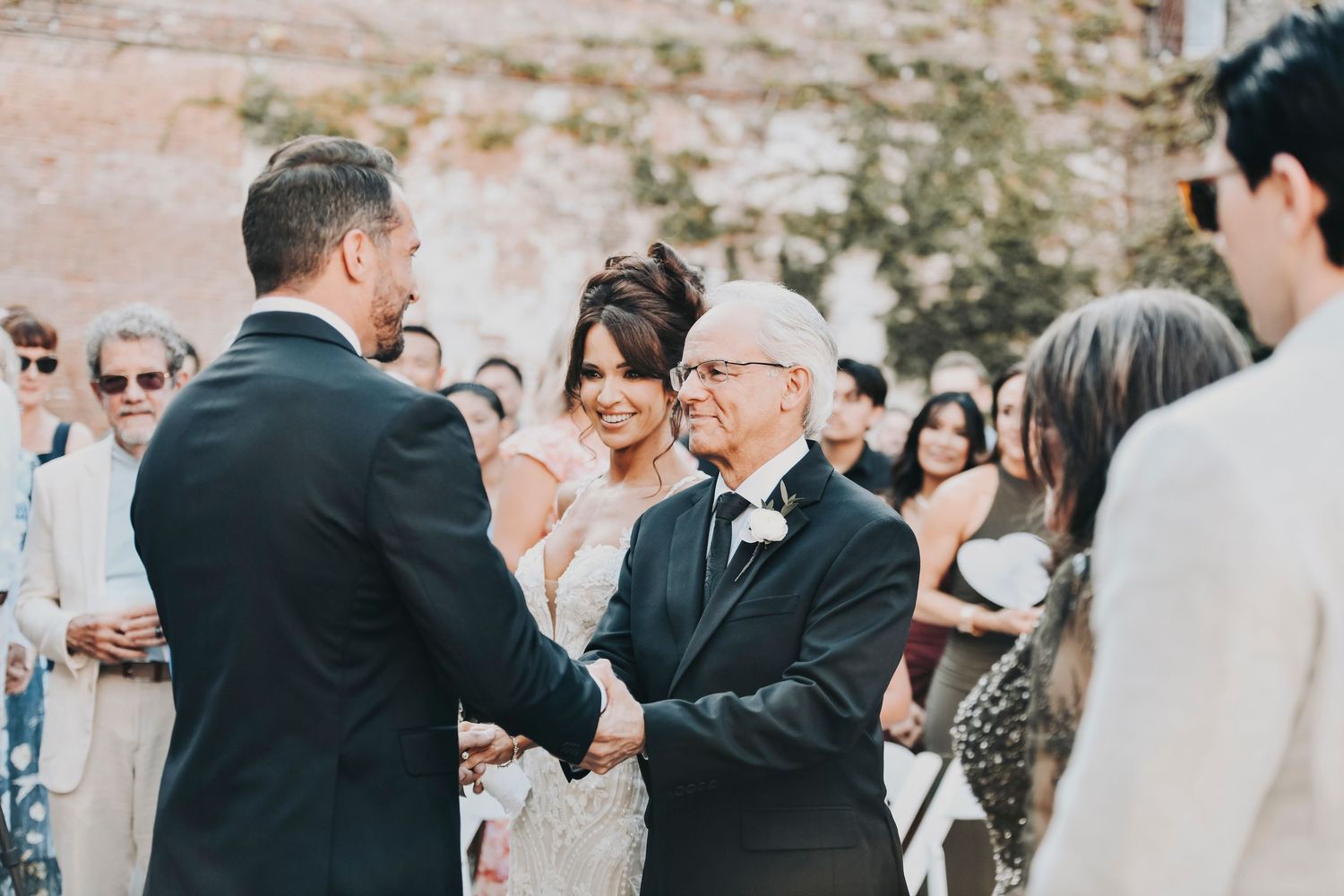 Megan and Joel exchanging vows at The Cotton Mill McKinney
