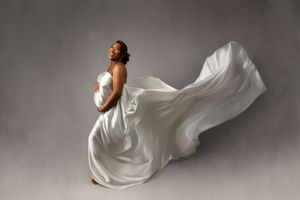 Ethereal white fabric flows dramatically through a series of artistic dance movement photographs in a studio setting.