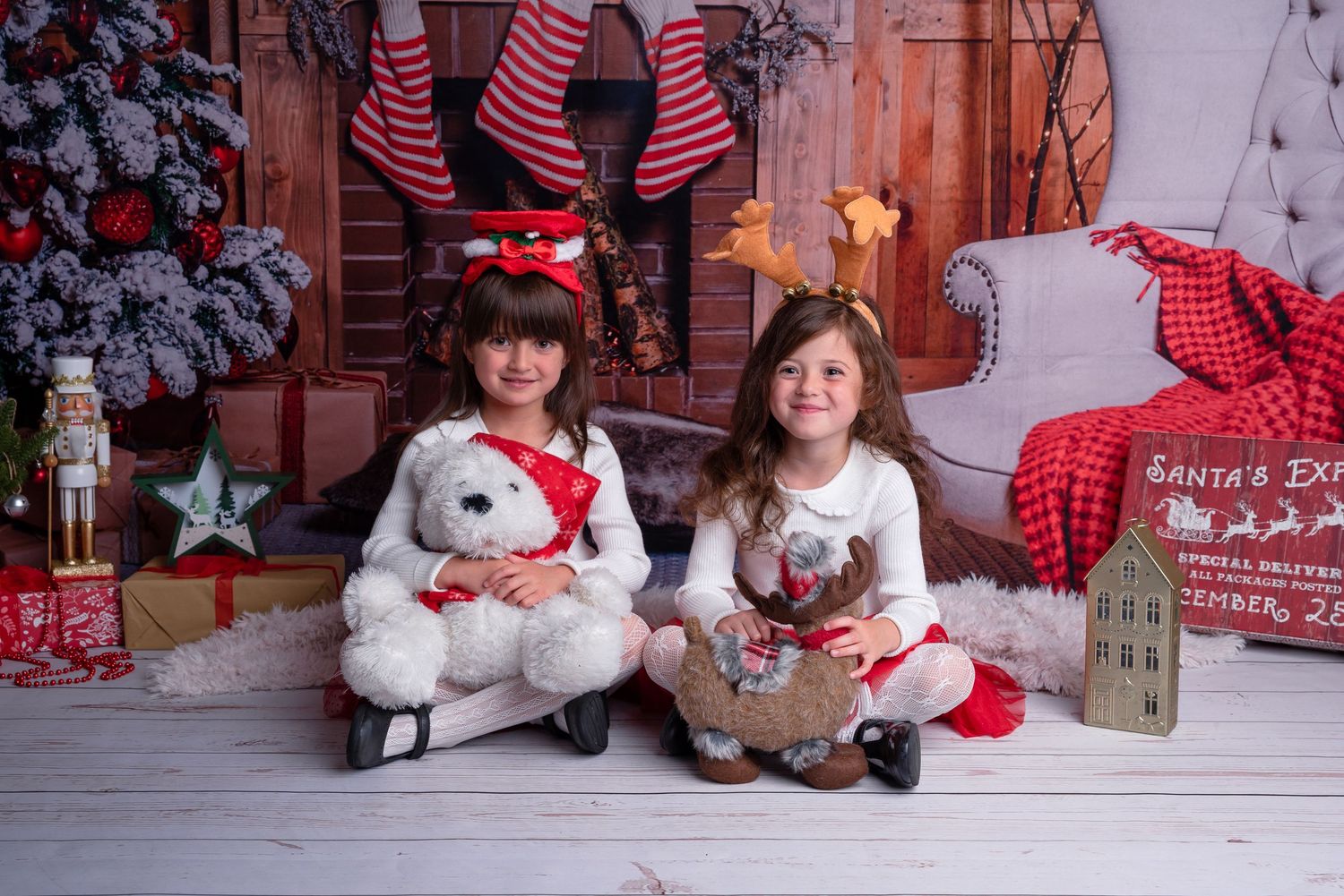 kids during christmas session with themed backdrop in Wolverhampton