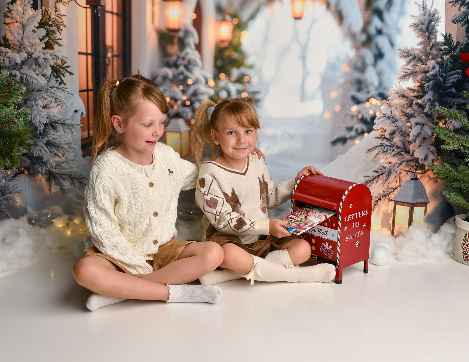Girls putting a letter in the letterbox for Santa during Christmas mini
