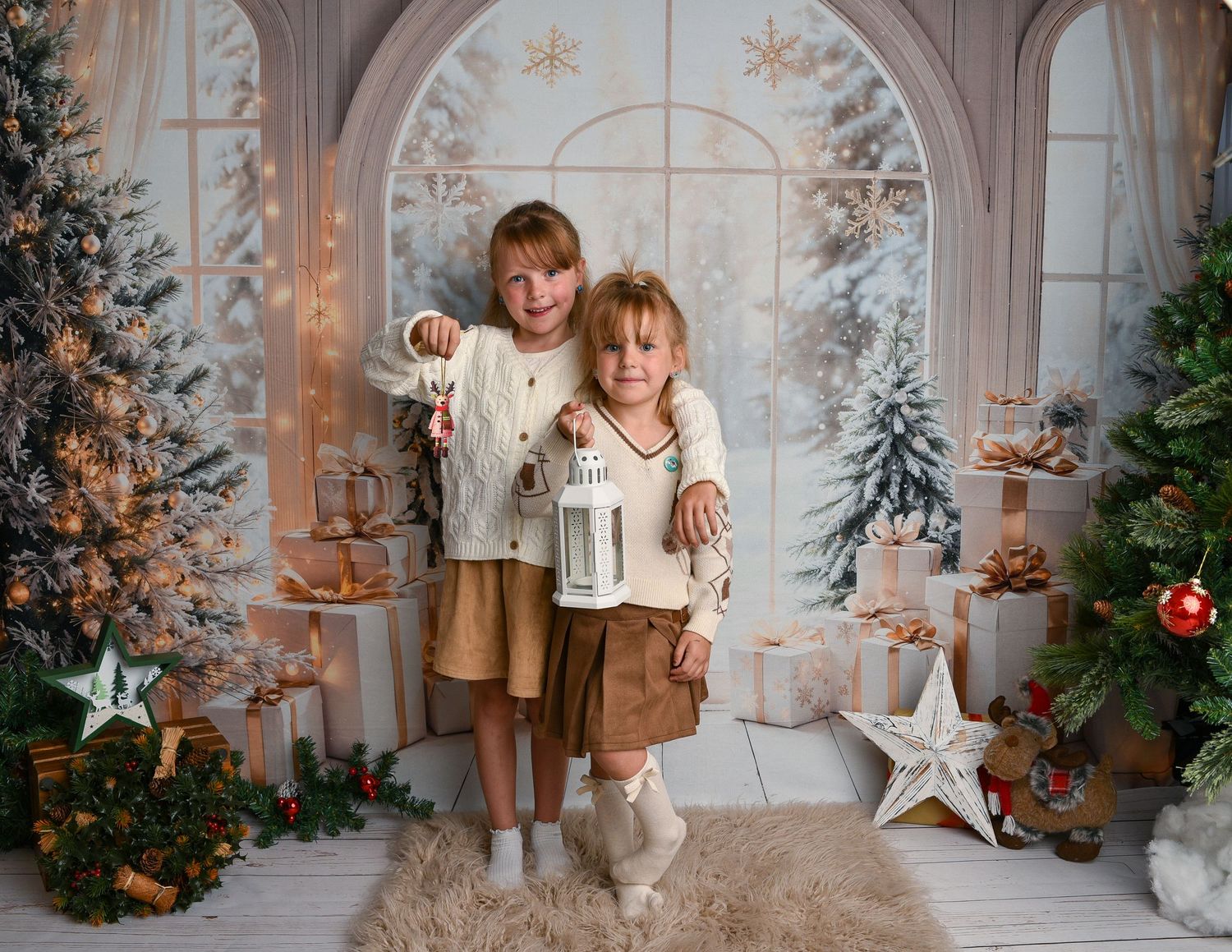 Christmas Mini Birmingham — Two girls holding a lantern in a cosy Christmas room during a Christmas Mini photo session in Birmingham.