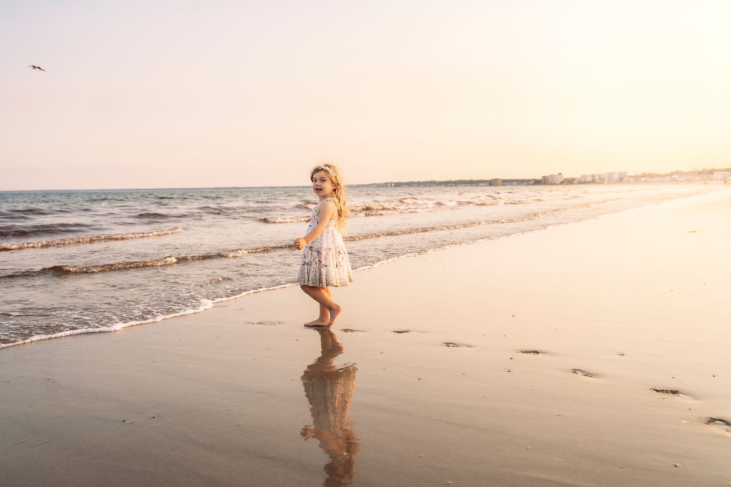 sunset photo of child on beach southern maine