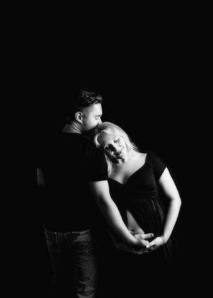 Dramatic black and white portrait with artistic shadows and movement.