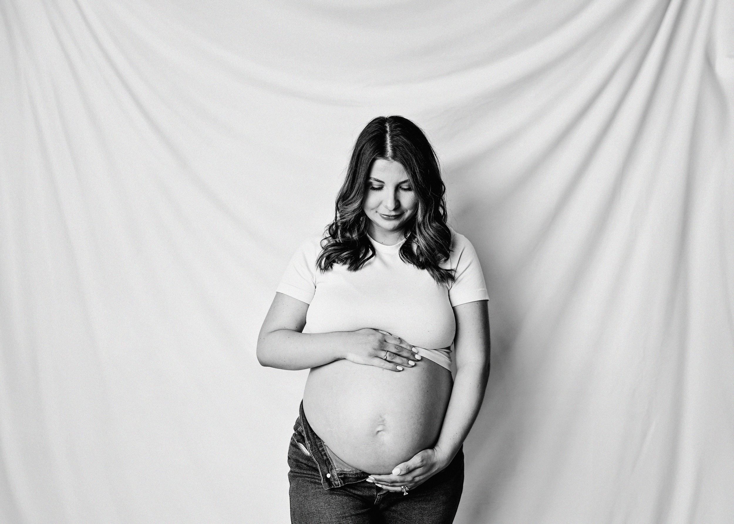 Black and white maternity portraits showing emotional connection.
